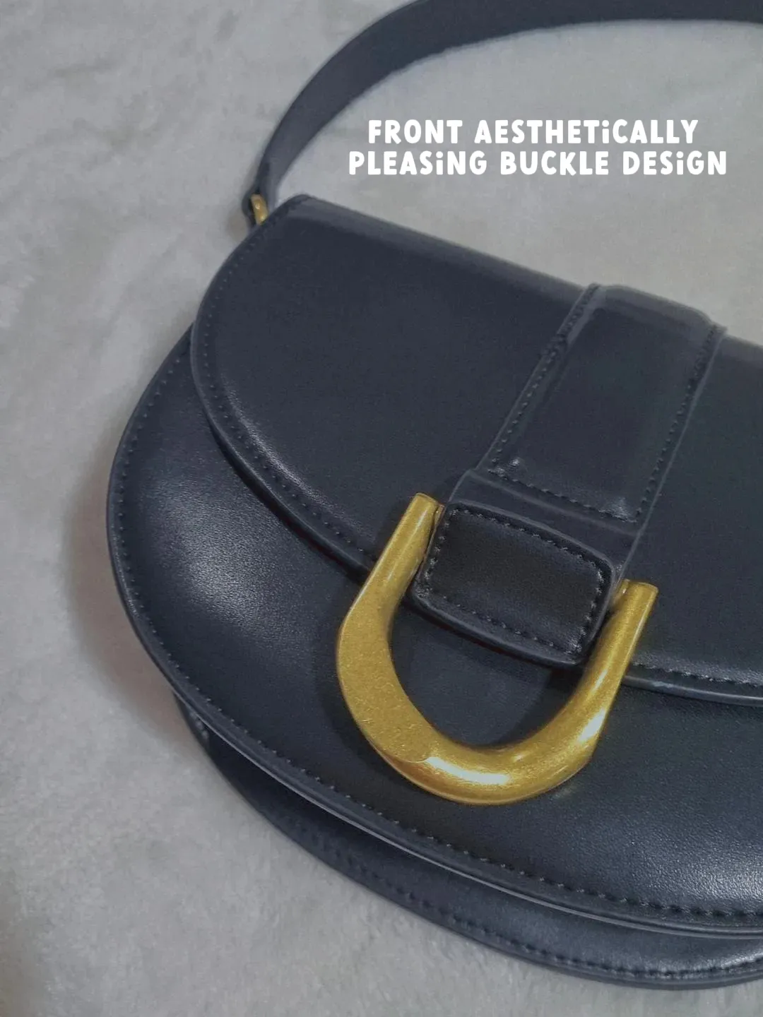 Charles_Keith on X: The Gabine leather saddle bag and buckled