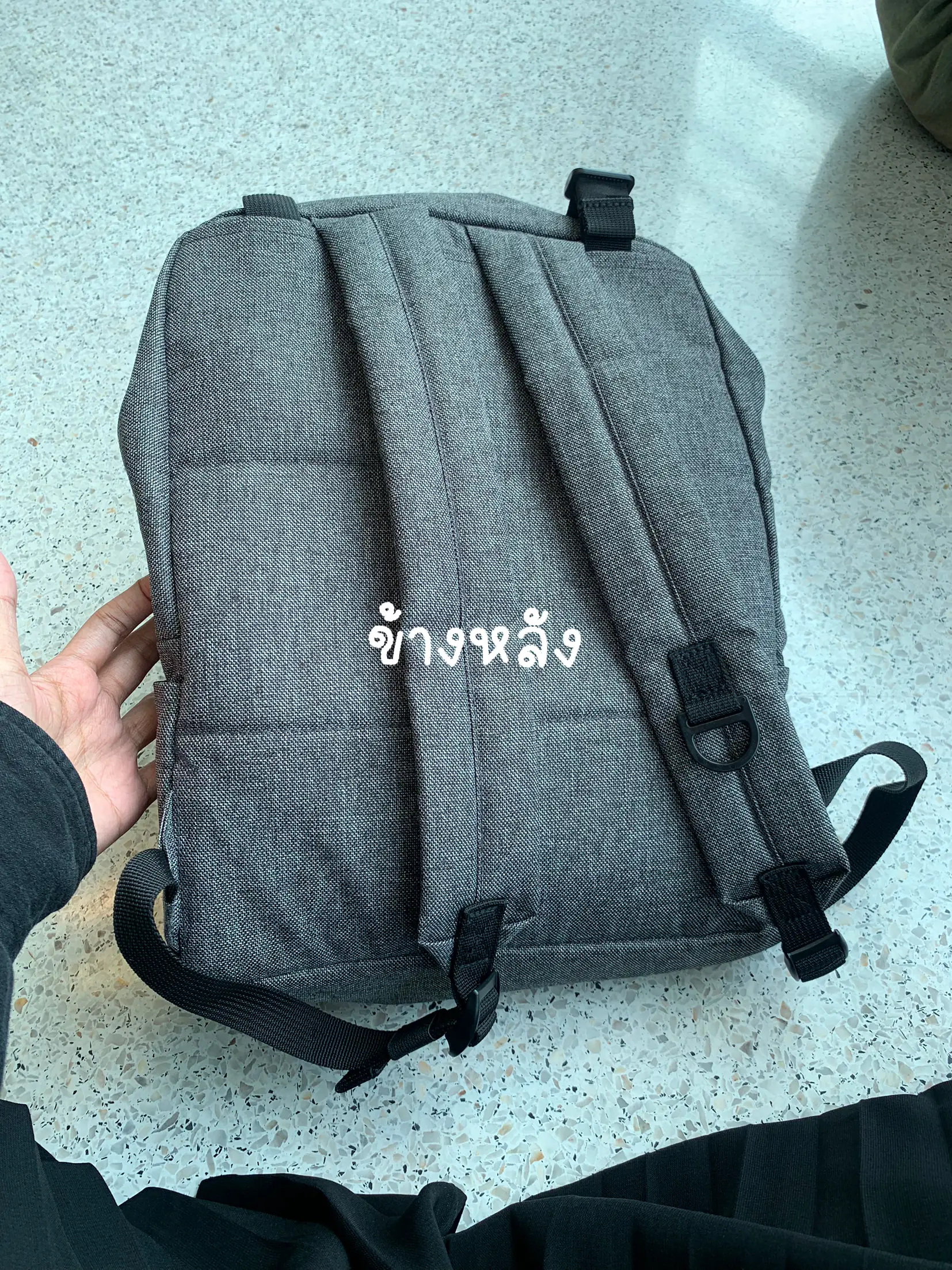 A practical Muji backpack used to study in Moo every day