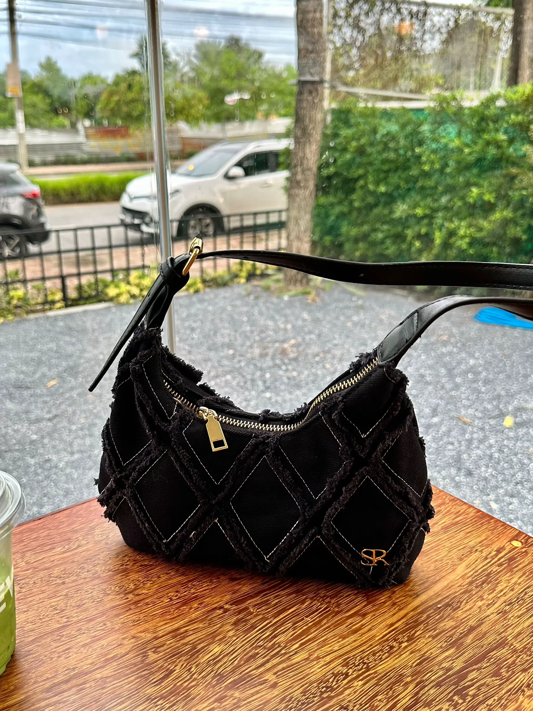 Inside Gigi Hadid's bag: What's in Gigi's glossy Prada Cleo tote?