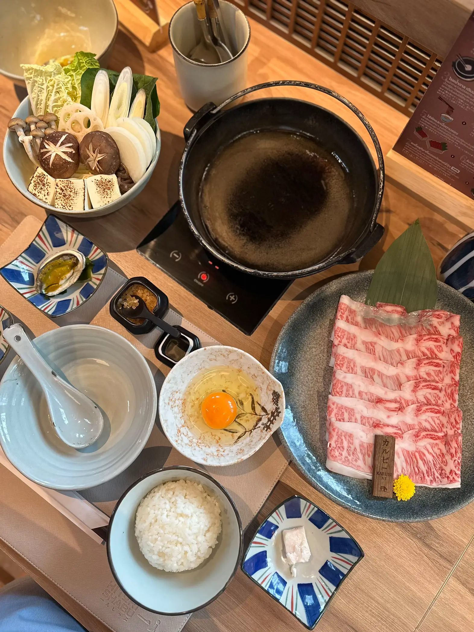 Split pot-one side for Sukiyaki and the other for Shabu Shabu