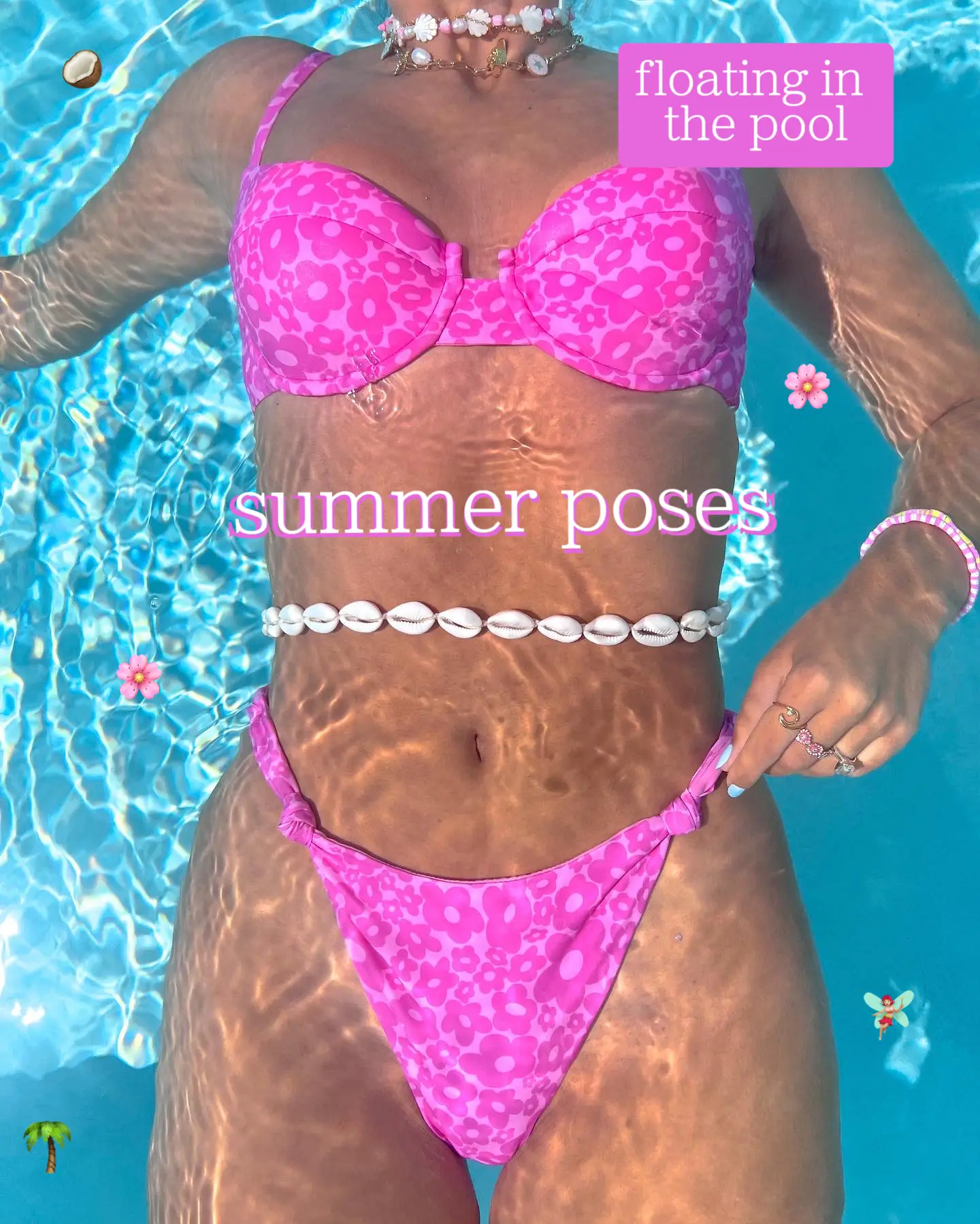  A woman wearing a pink bikini is floating in the pool.