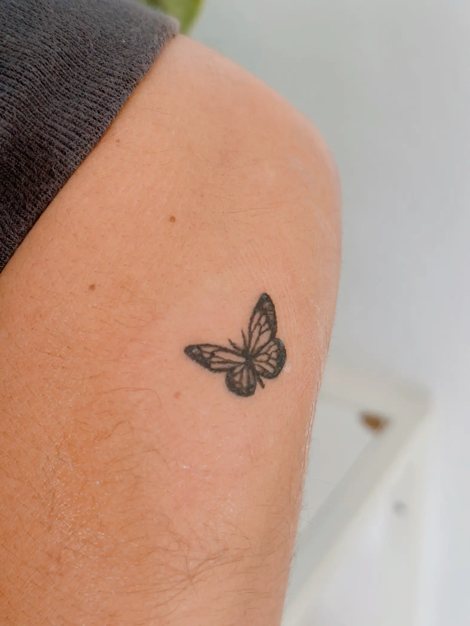 simple black butterfly tattoo