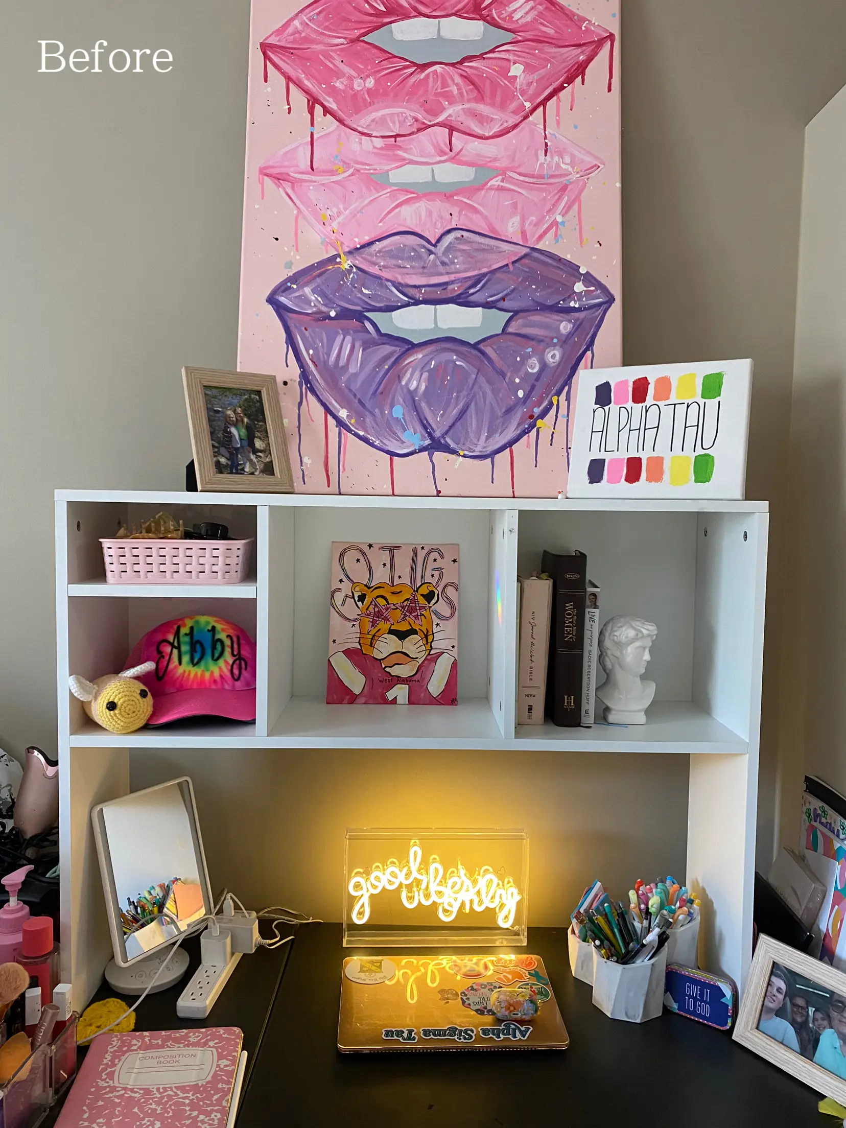  A bookshelf with books and a painting of a woman's lip.