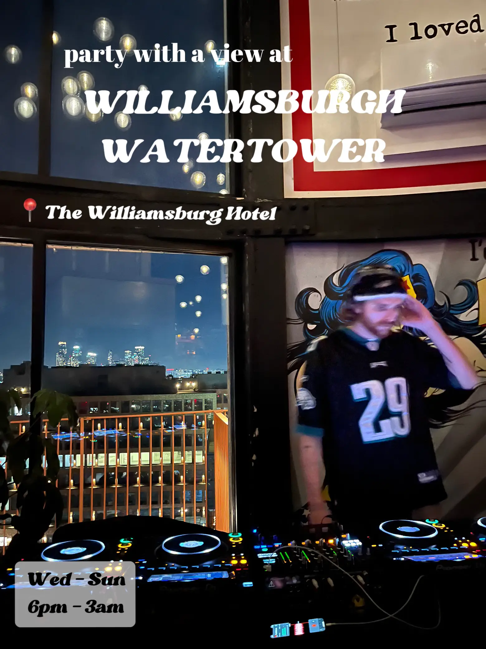  A man is DJing at the Williamburg Hotel and Water tower.