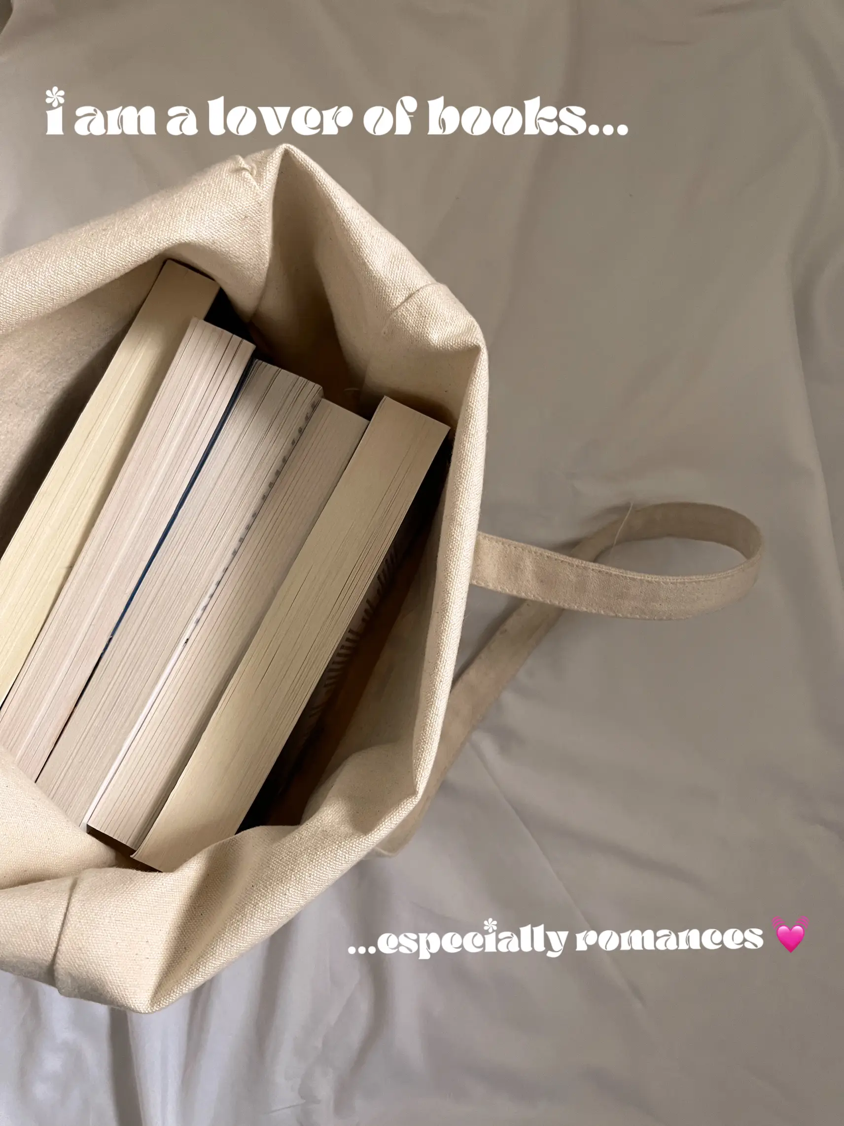  A bag of books with a white background and a pink heart.