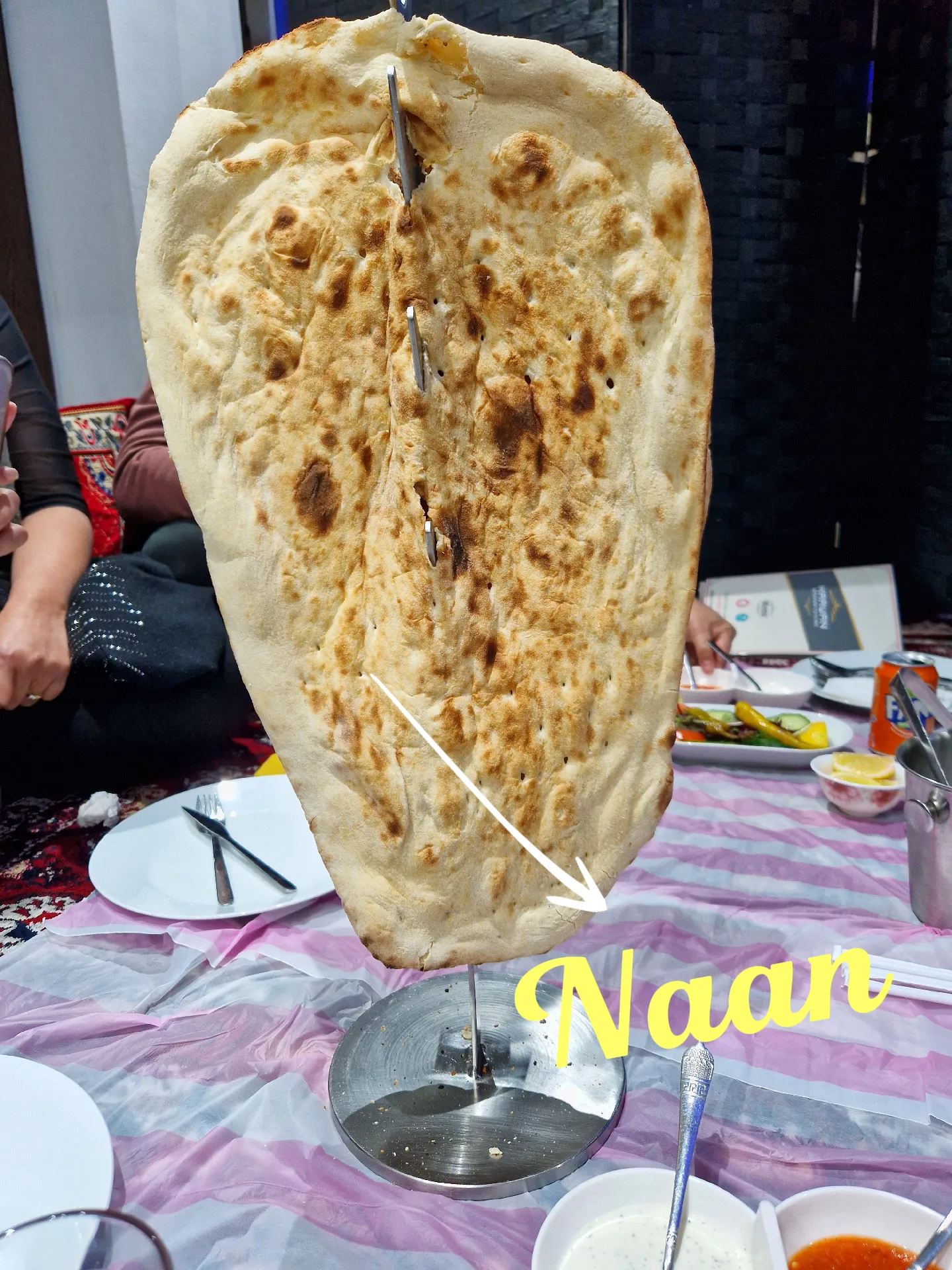 Naan Indian Bread Hand Made and Cooked in a Clay Oven in Old Spiltafields  Market, London 