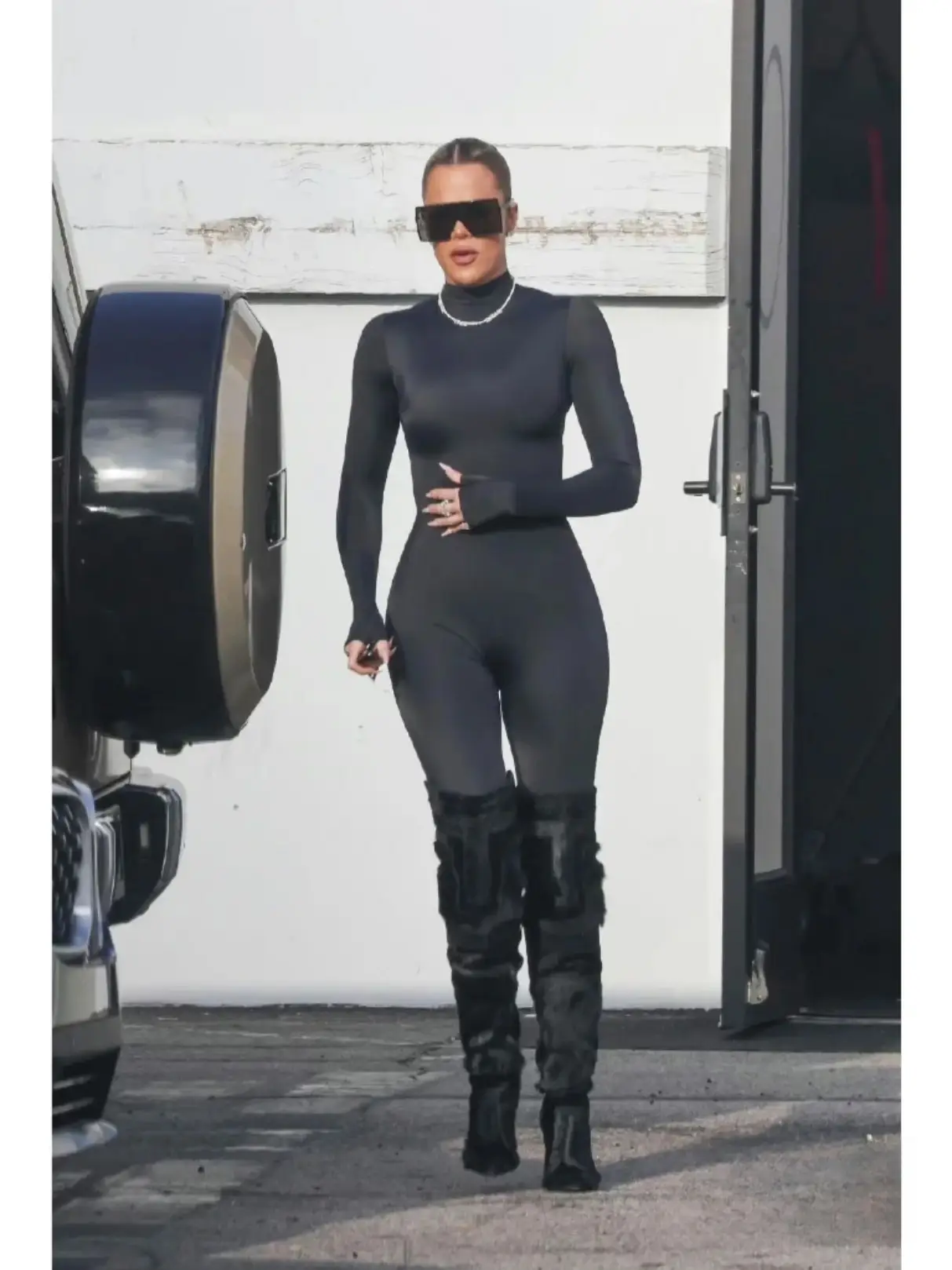 Kim and Khloé Kardashian Match in Black Bodysuit and Catsuit