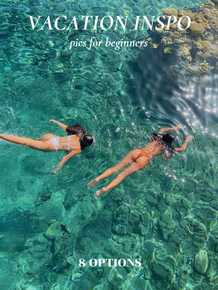  Two women are swimming in the ocean, wearing bikini's.