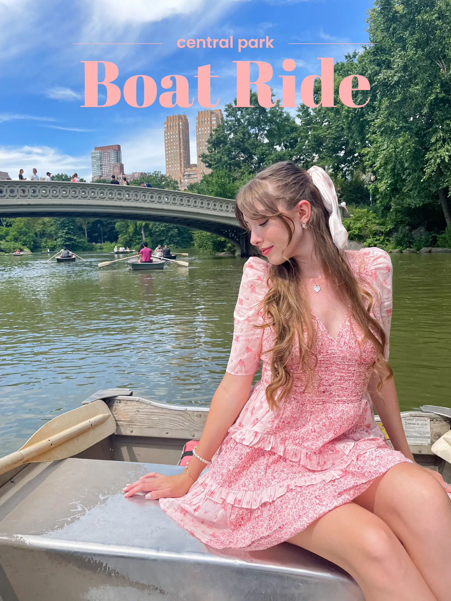  A woman in a pink dress is sitting in a boat.