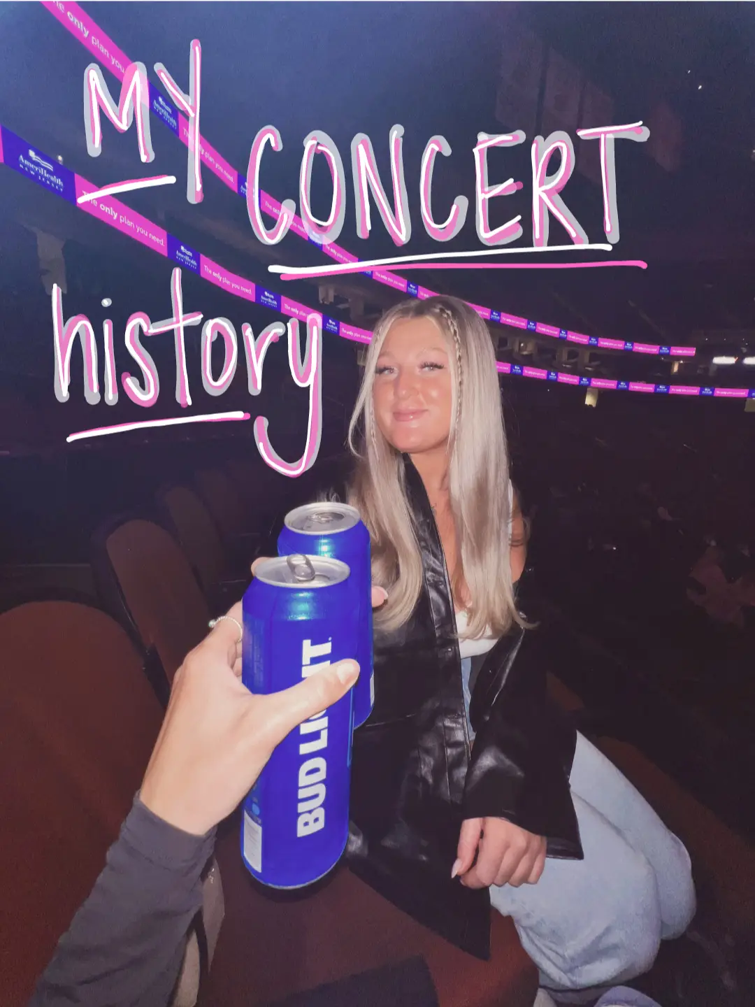  A woman is sitting in a row of seats at a concert. She is holding a can of Bud Light beer in her hand.