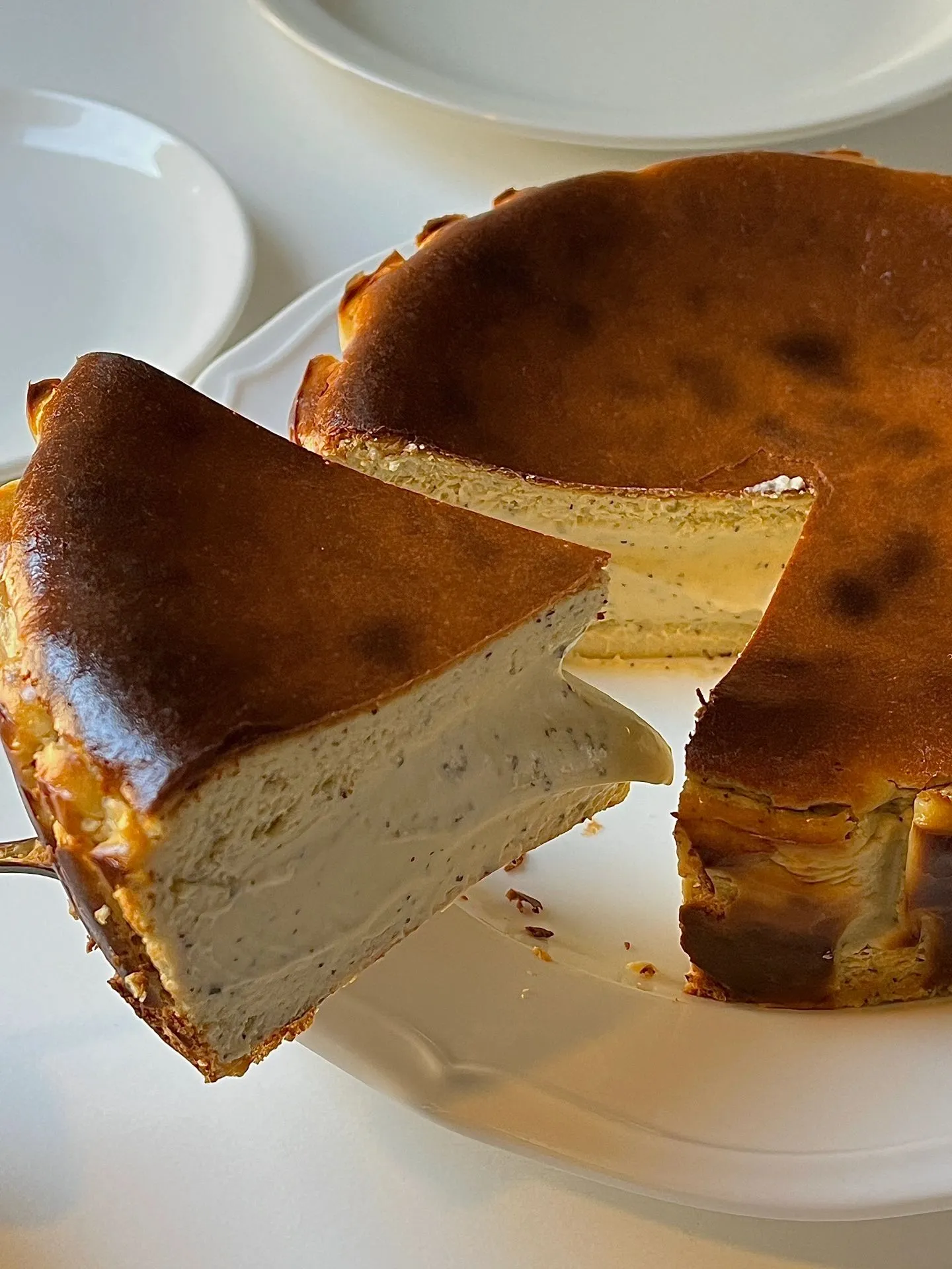  A slice of cheese cake on a plate.