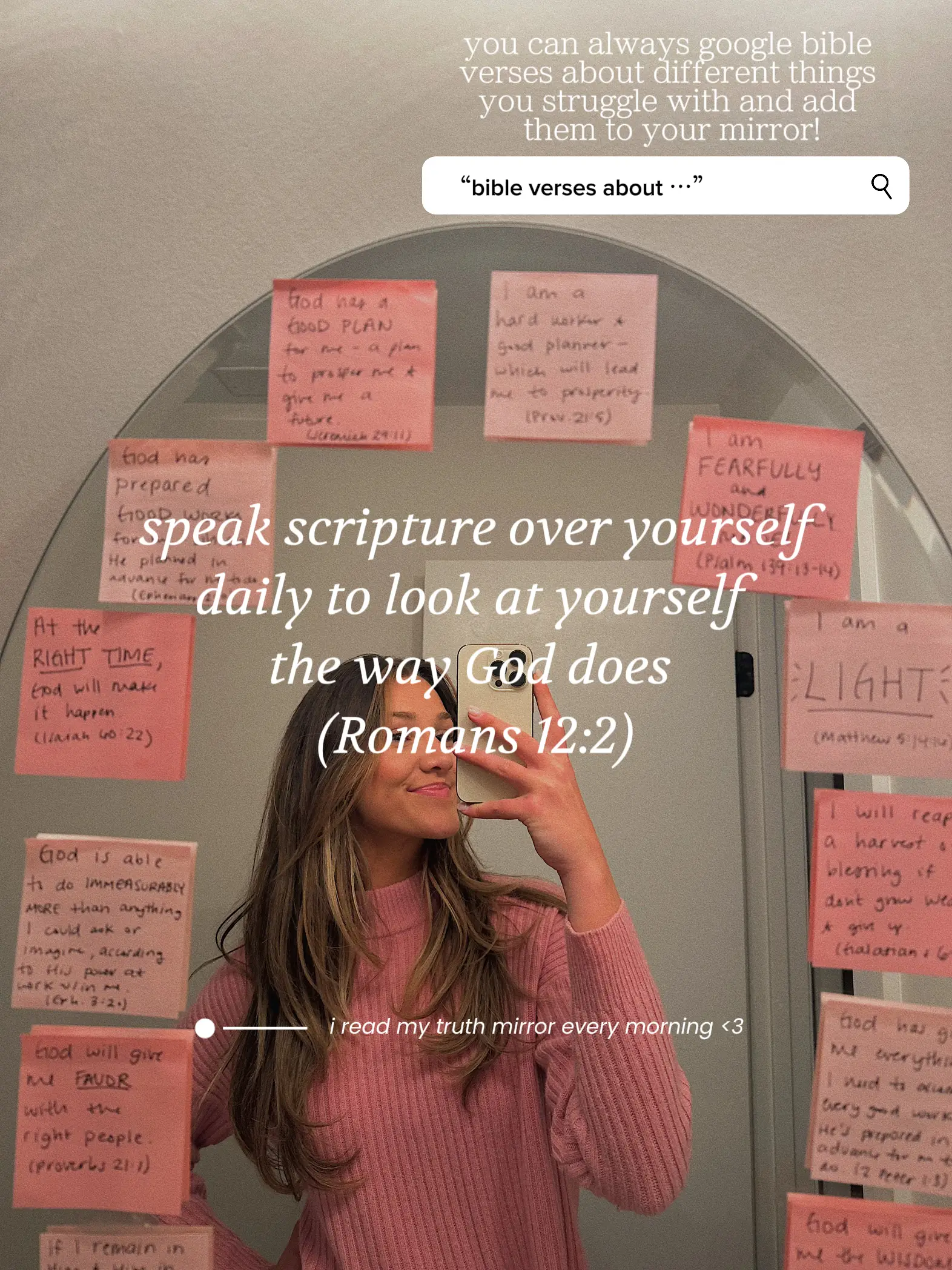  A woman taking a selfie in front of a mirror with a sign that says "speak scripture over yourself".