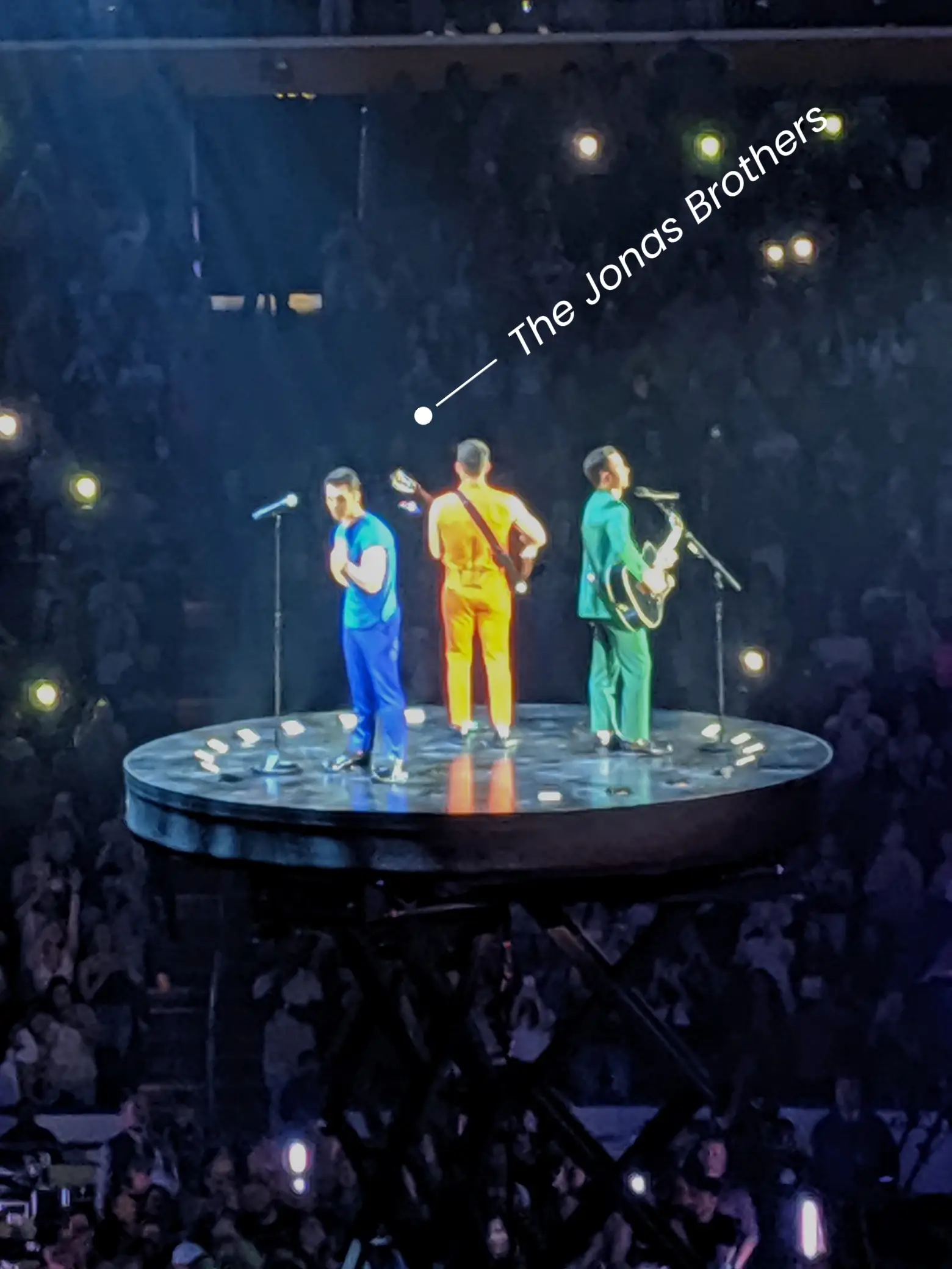  A group of men in blue performing on stage.