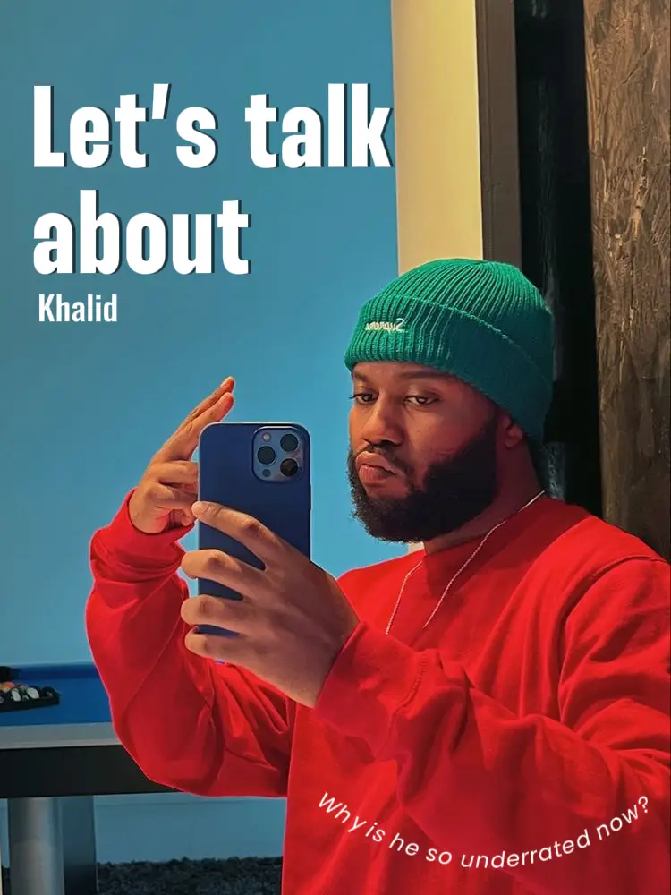  A man wearing a red shirt and a green hat is taking a selfie with his cell phone.