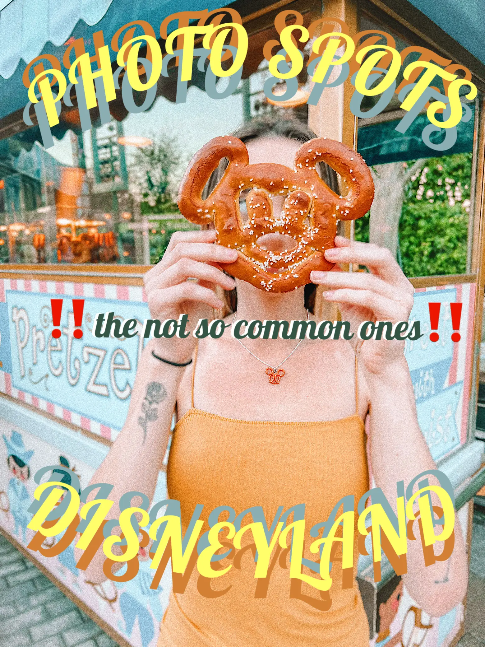  A person is holding a pretzel in front of a sign that says "Portland".