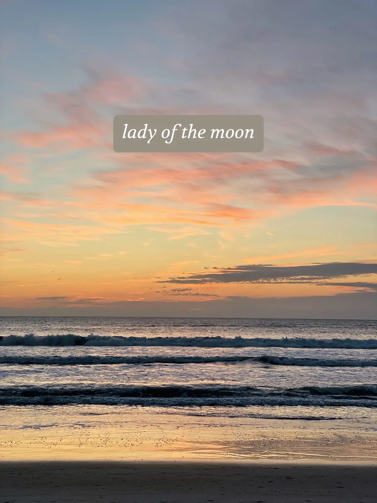  The image shows a beach with the ocean and the moon. The moon is casting a warm glow over the water, creating a beautiful scene. The beach is empty, with no people visible in the image.