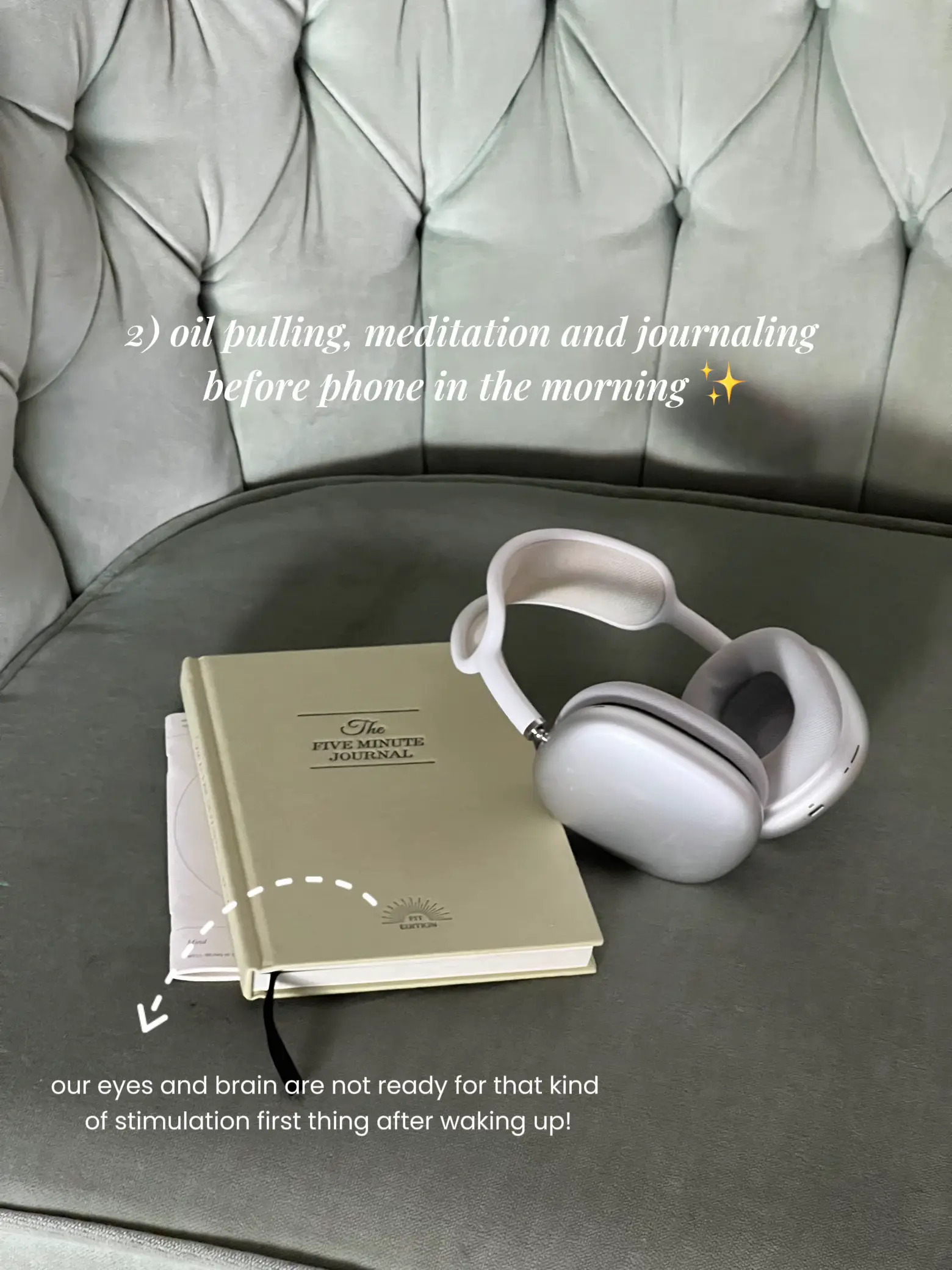 A book and headphones are on a couch.