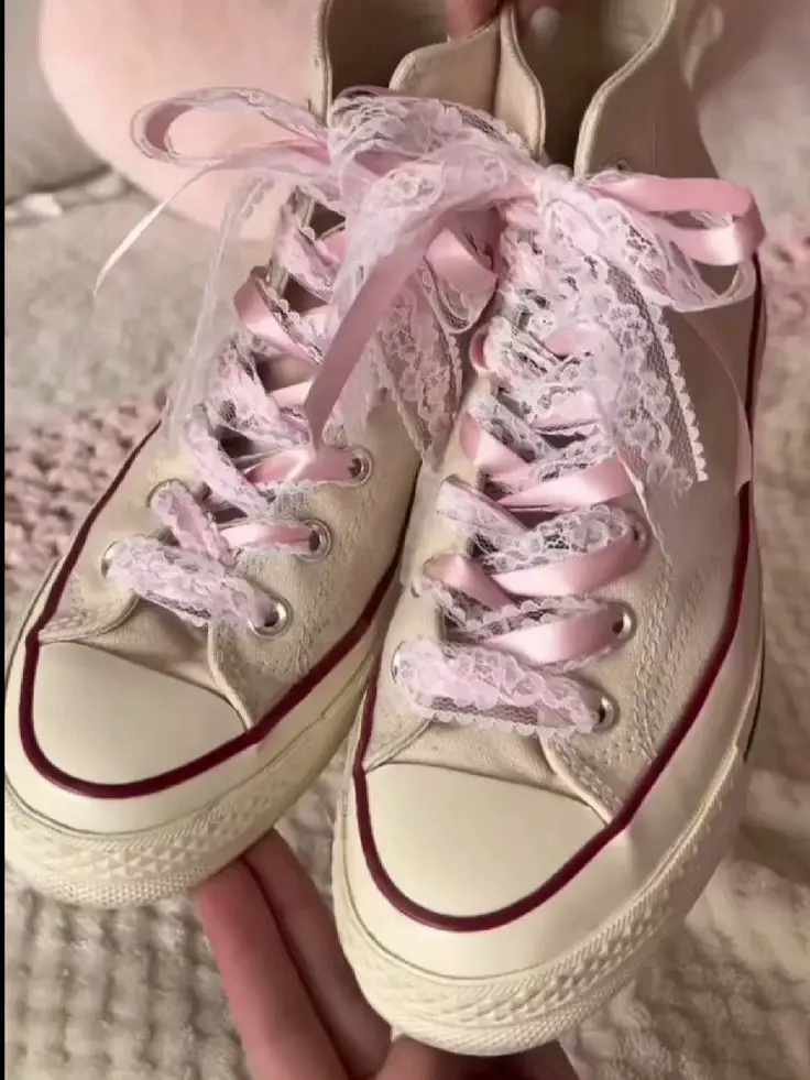 Pink converse hotsell with ribbon laces