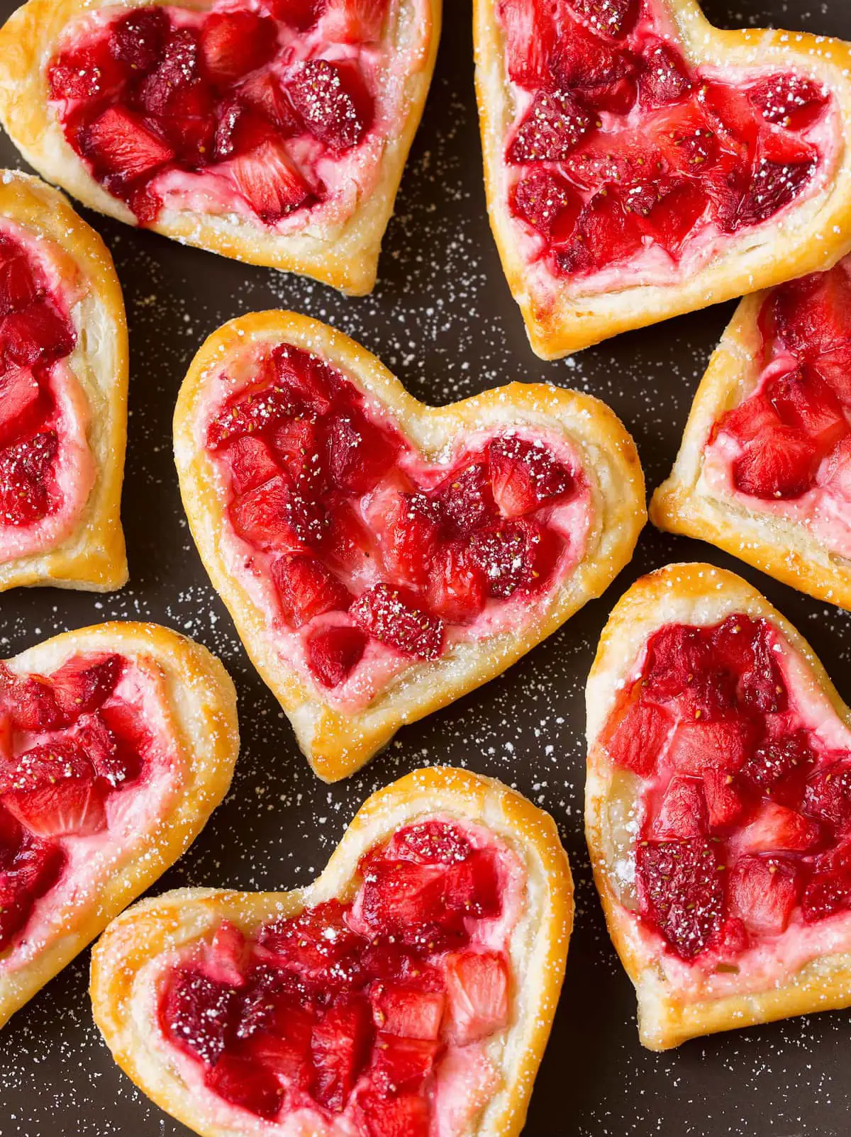  A row of pink hearts shaped like pizza.