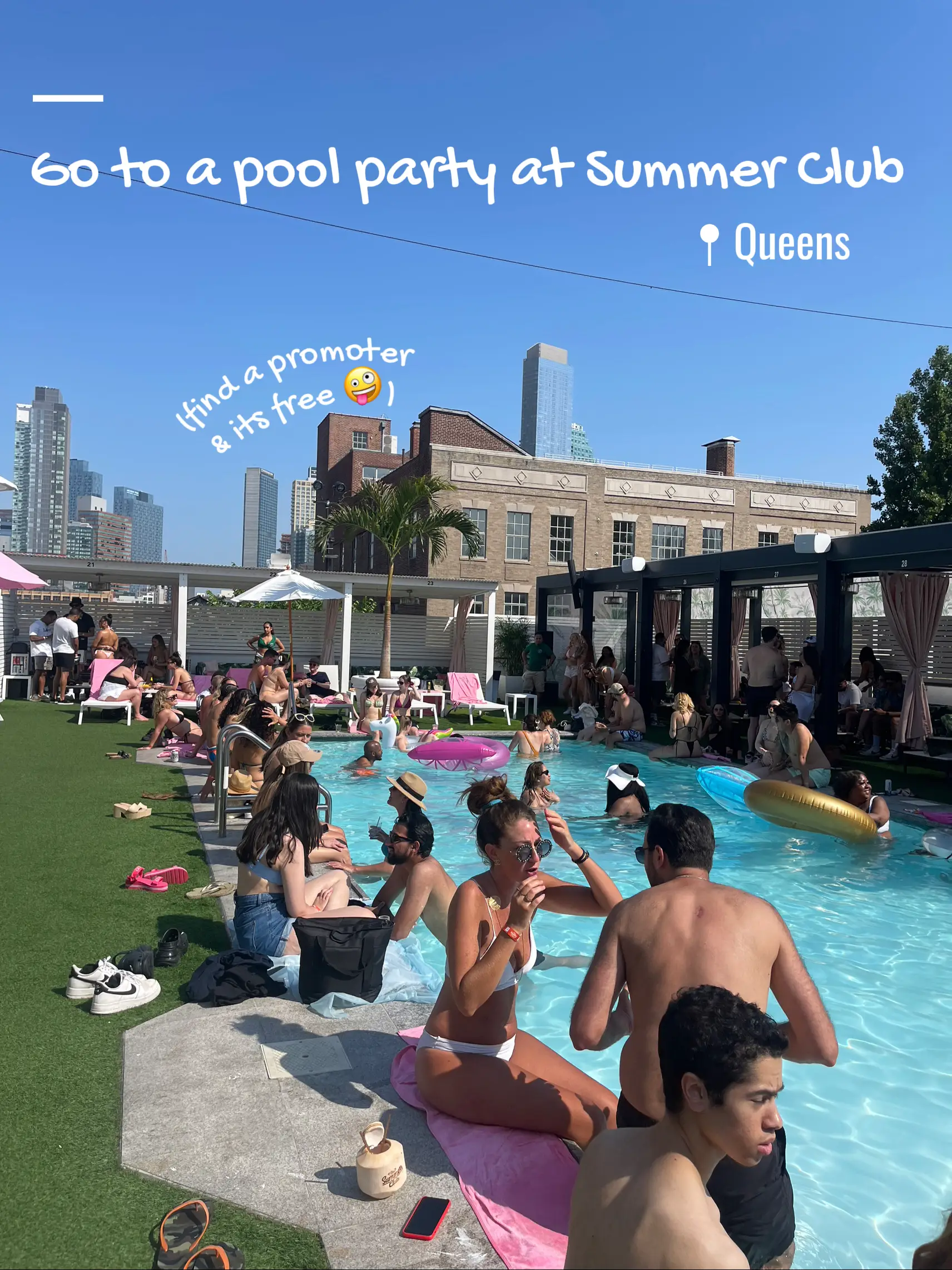  A group of people are sitting in a pool at a summer club.