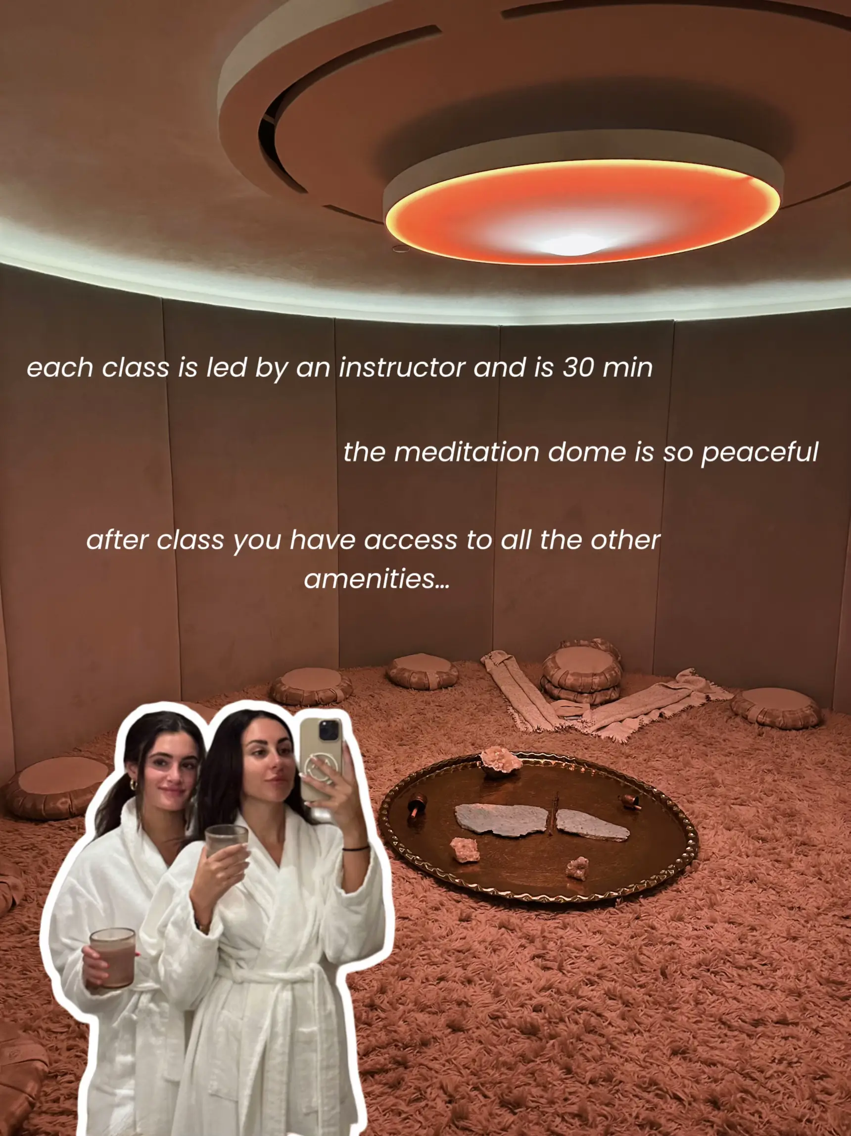  Two women are taking a selfie in a room with a dome.
