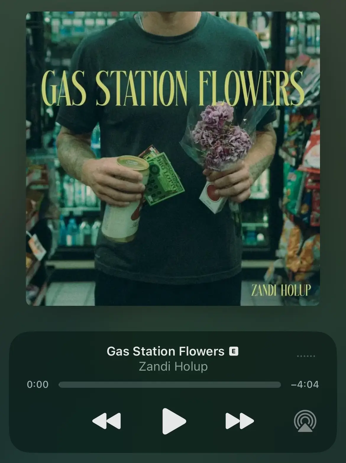  A man holding a can of gas and a flower.