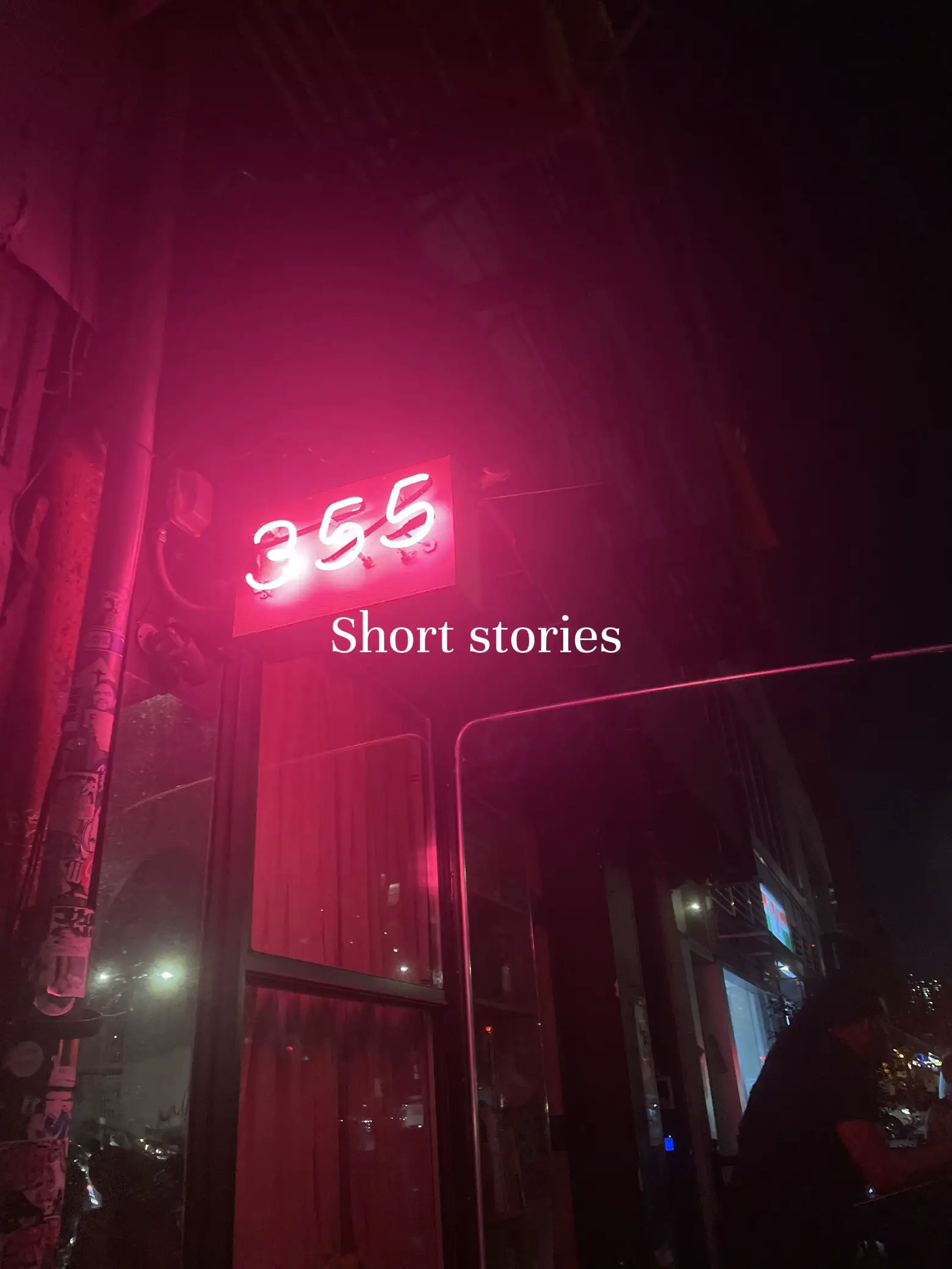  A neon sign with 355 Short stories.