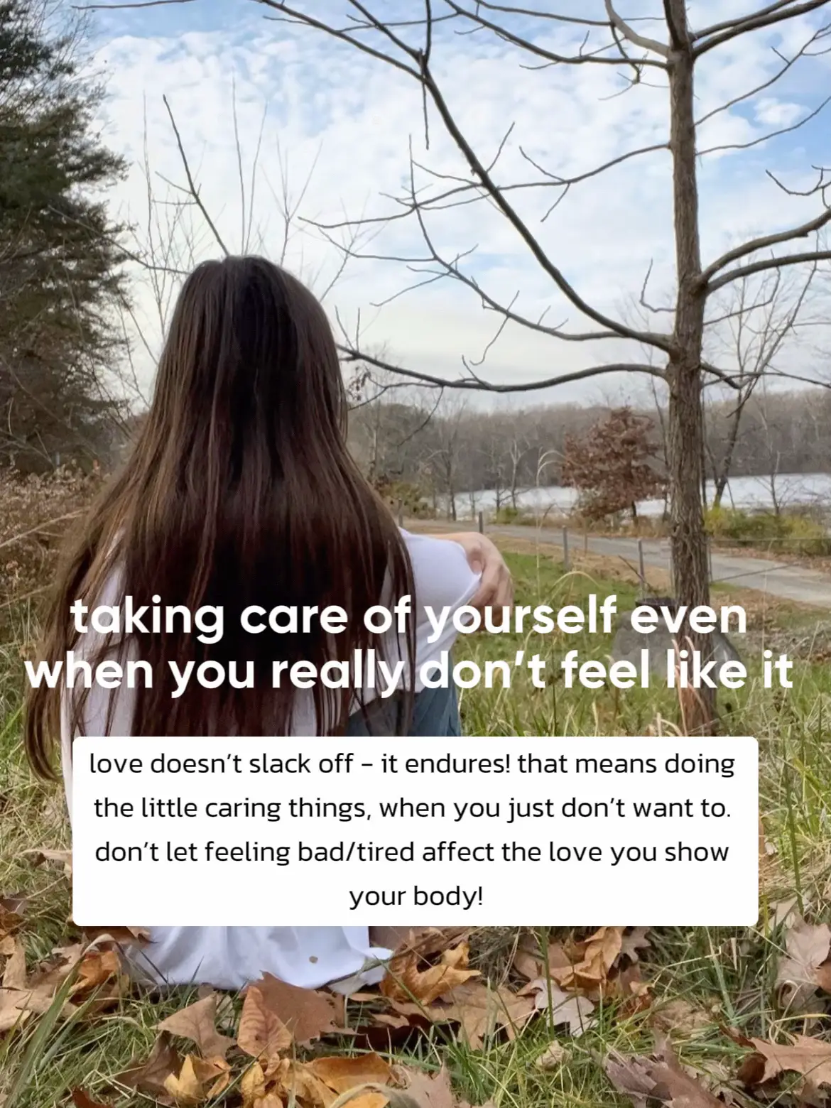  A woman sitting in front of a tree with a sign that says "taking care of yourself even when you really don't feel like it. love doesn't slack off - it endures! that means doing the little caring things, when you just don't want to don't let feeling bad