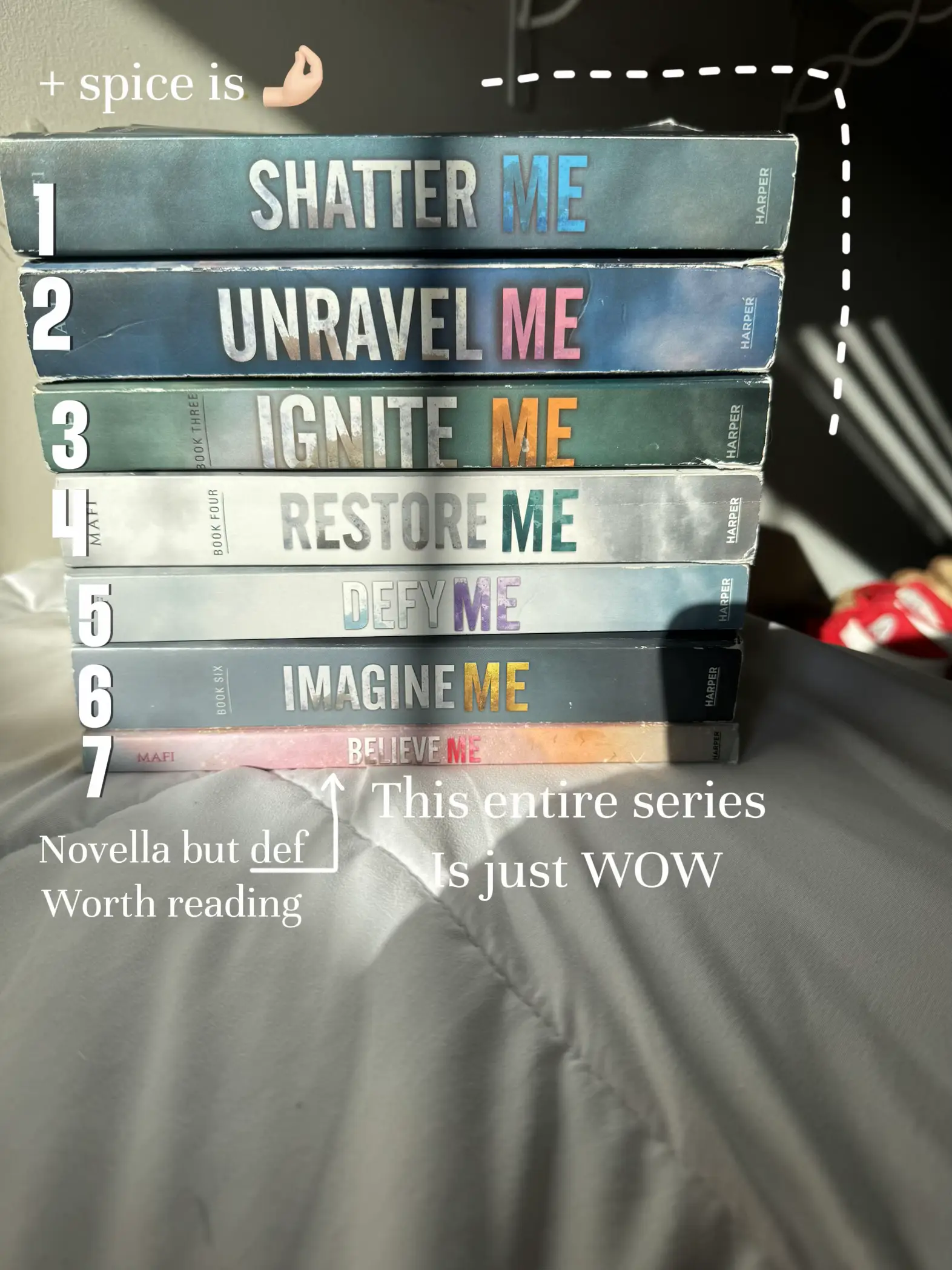  A stack of books with the title Shatter Me at the top.