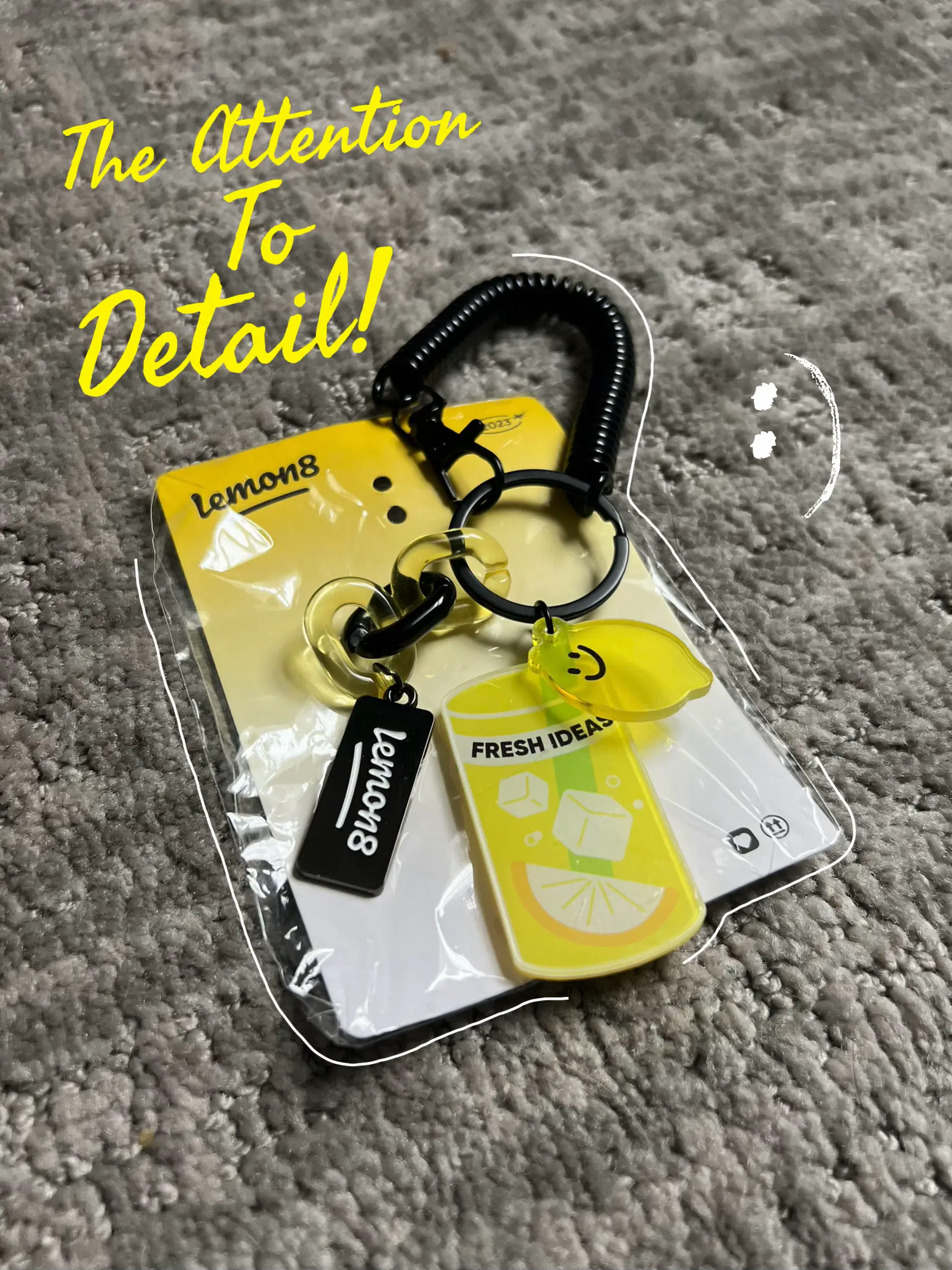  A key chain with a lemon on it.