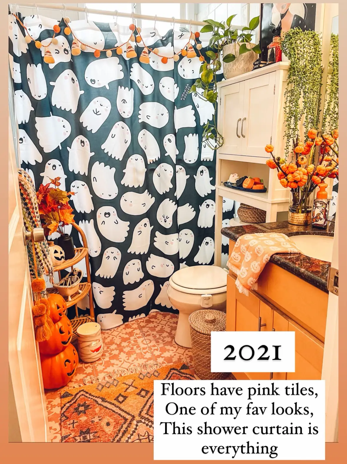  A bathroom with a pink shower curtain and a potted plant.