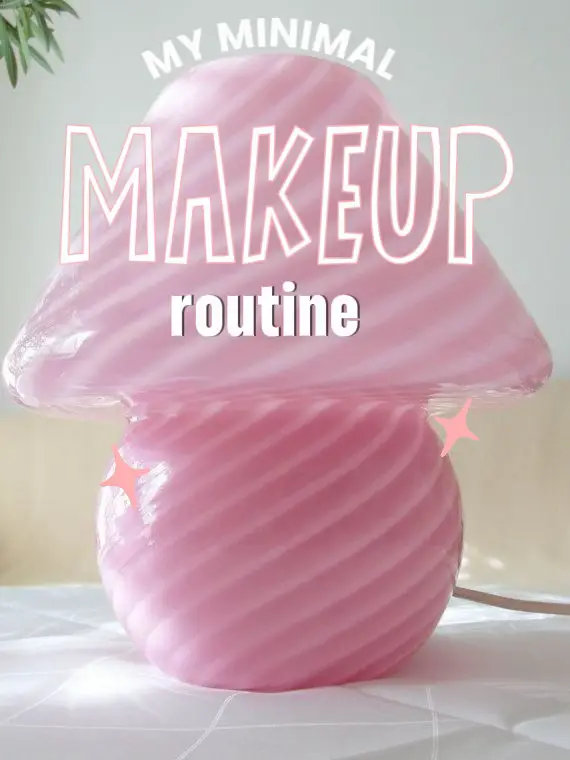  A pink makeup bag with a pink makeup brush.