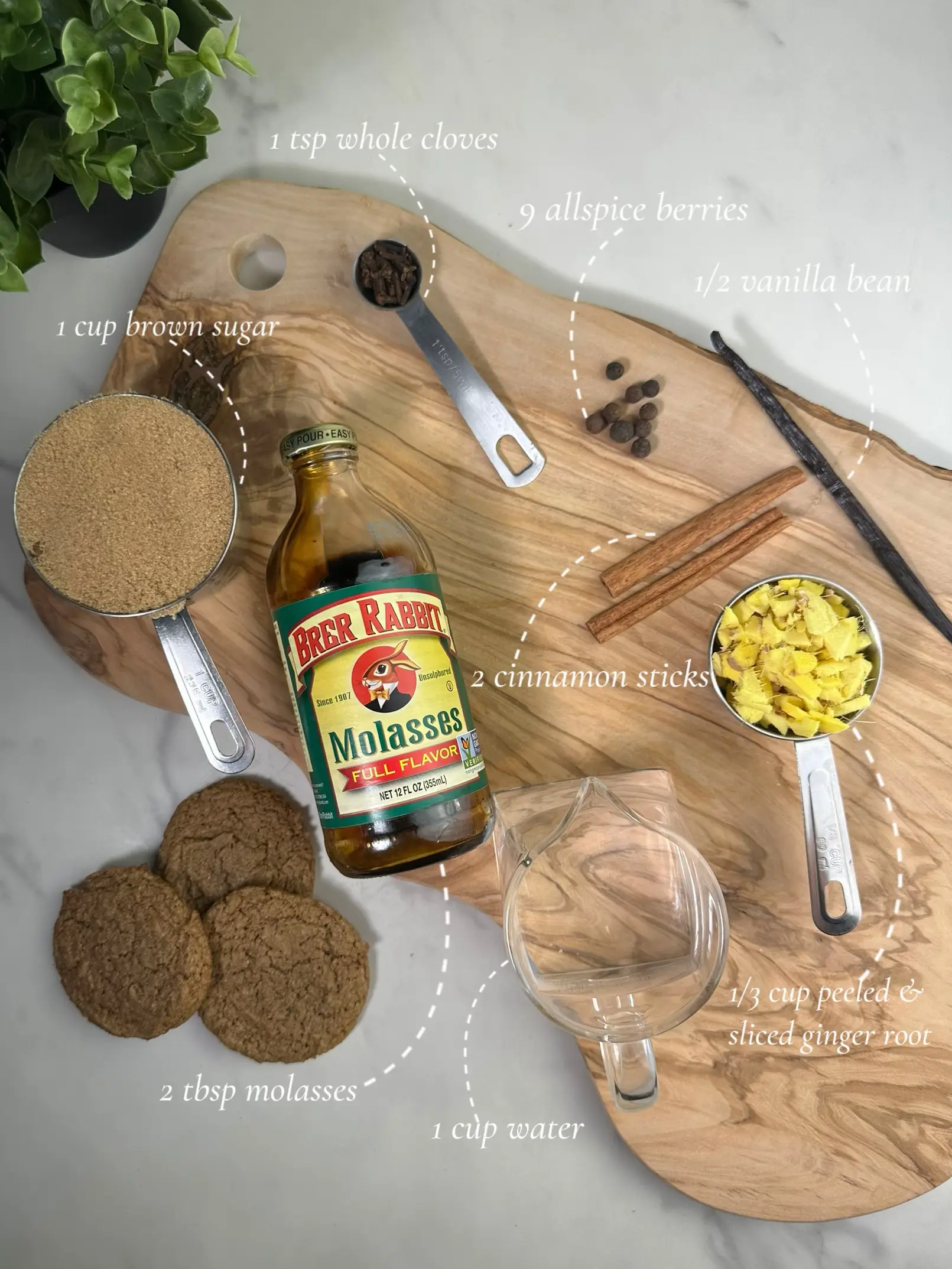  A wooden cutting board with a variety of ingredients for making a cup of coffee.