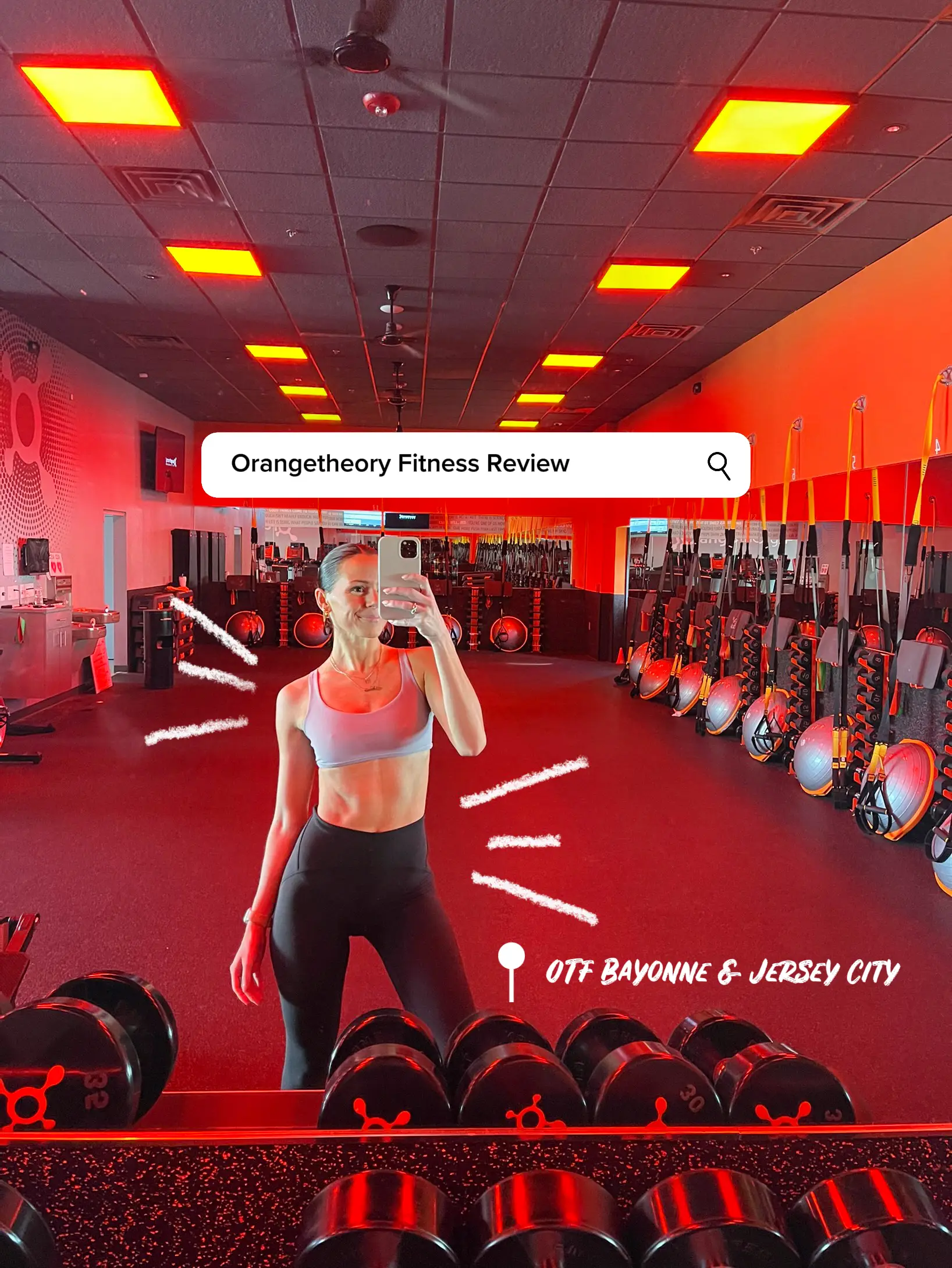  A woman taking a selfie in a gym.