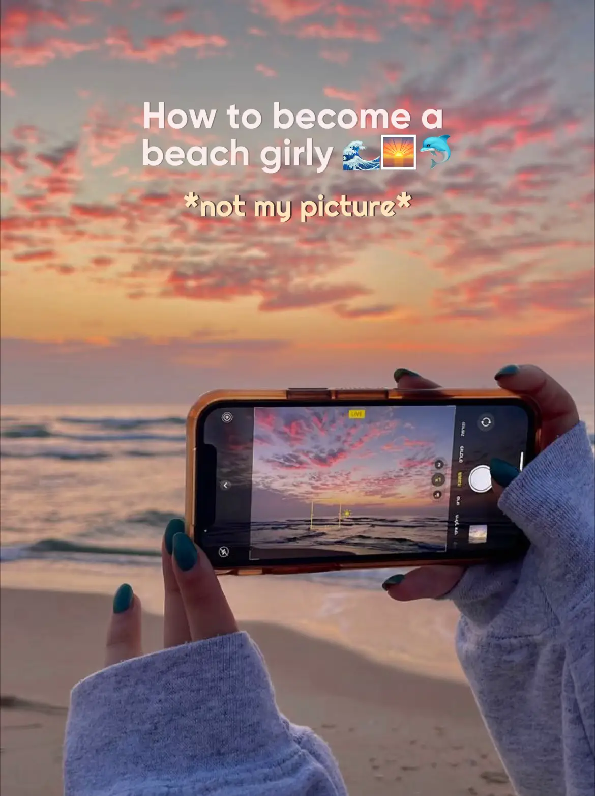  A woman is taking a selfie on a beach.