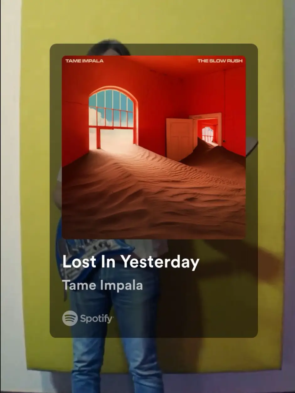  A person is standing in front of a blue wall with a sign that says "Lost in yesterday".