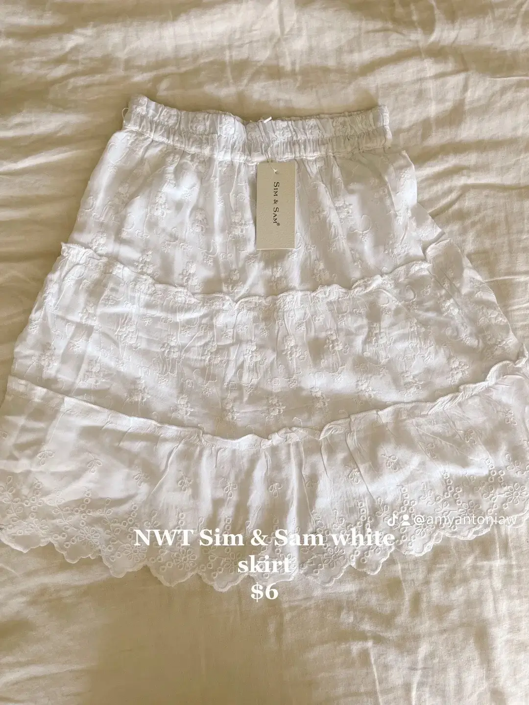 A white skirt with a price of $6.
