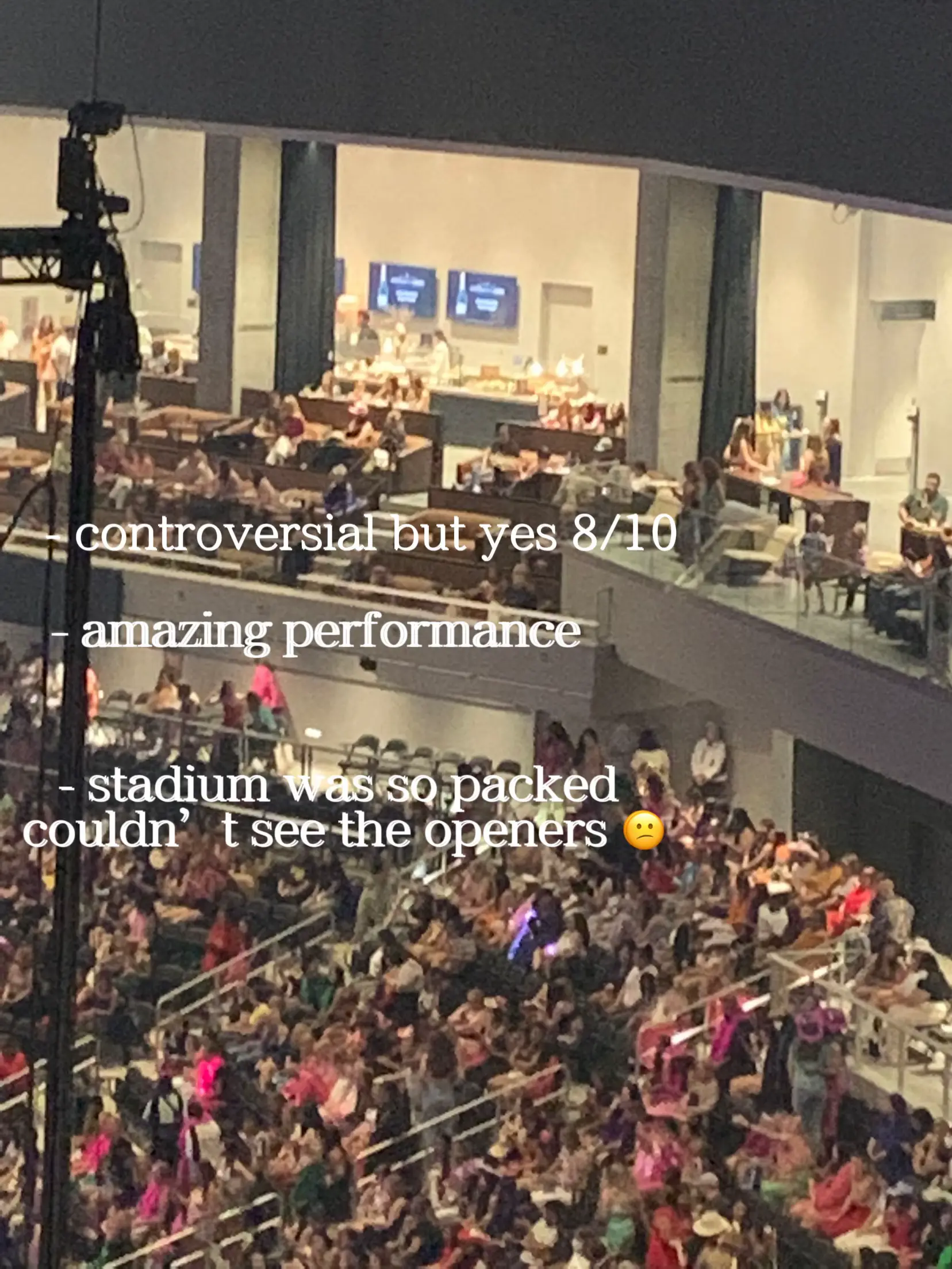  A large crowd of people are gathered in a stadium, watching a concert. The performance is described as controversial but yes, and the audience is described