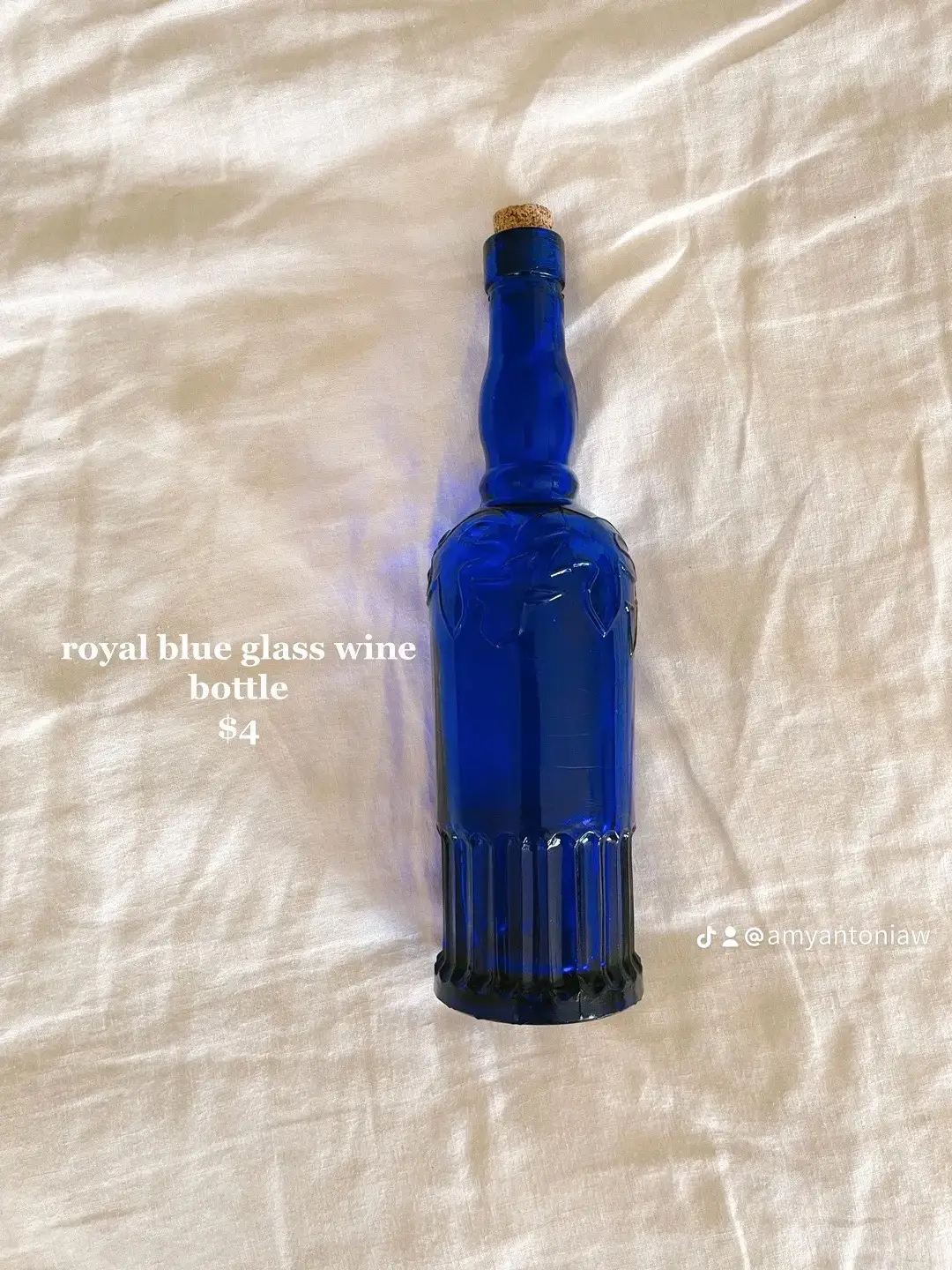  A bottle of royal blue glass wine.