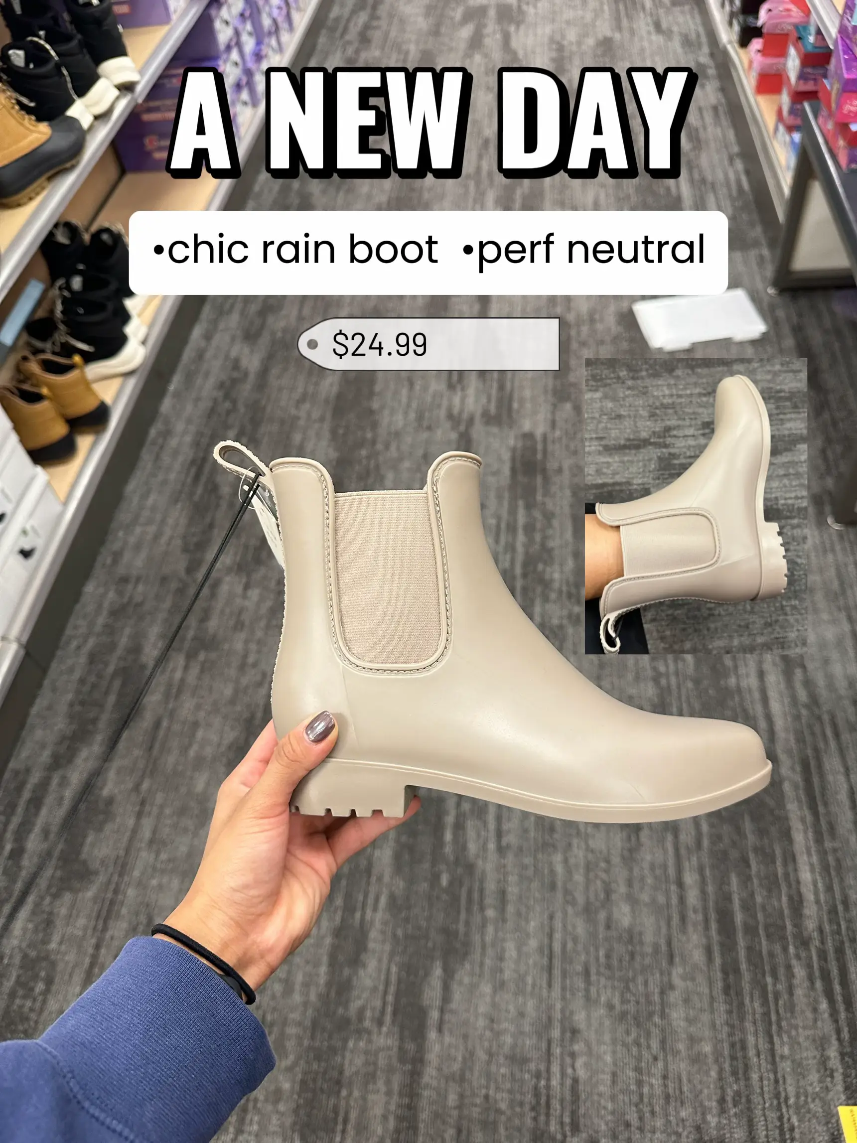  A person is holding a pair of boots in a store.