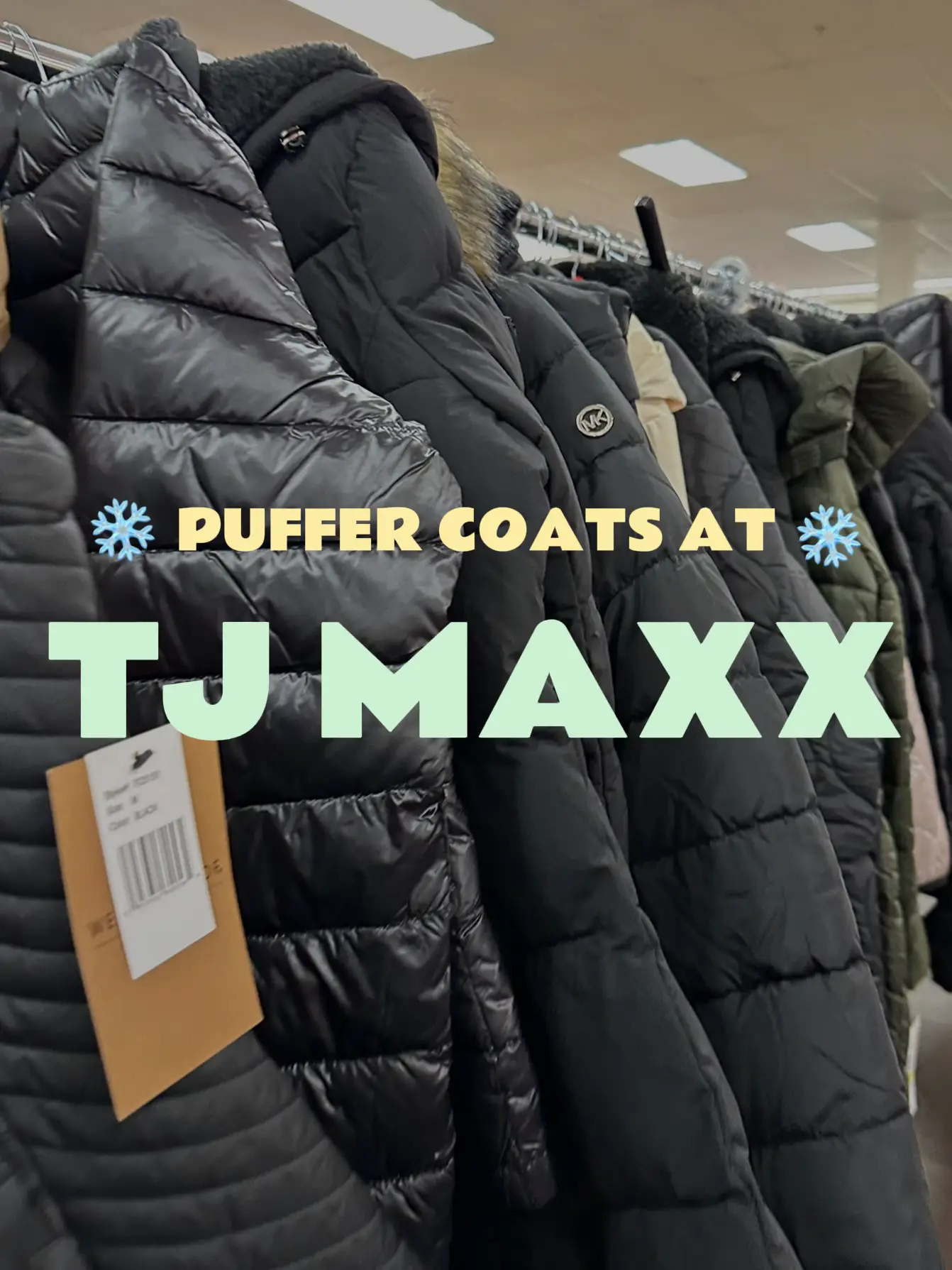  A collection of puffer coats in a store.