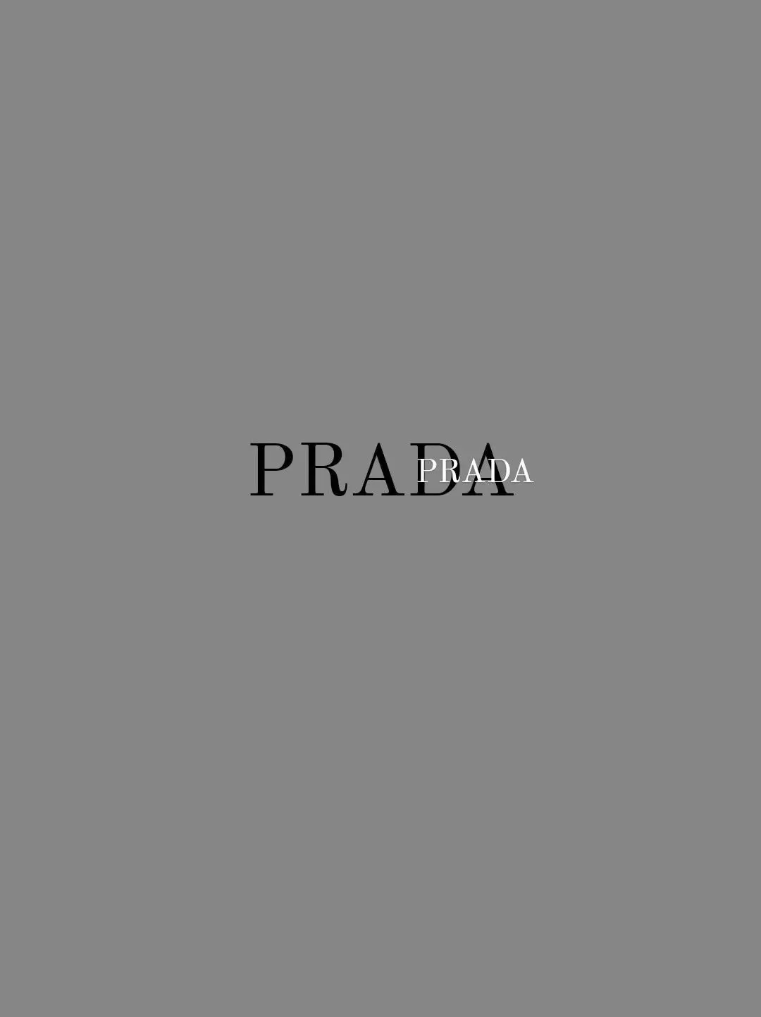  A white background with the word Prada on it.