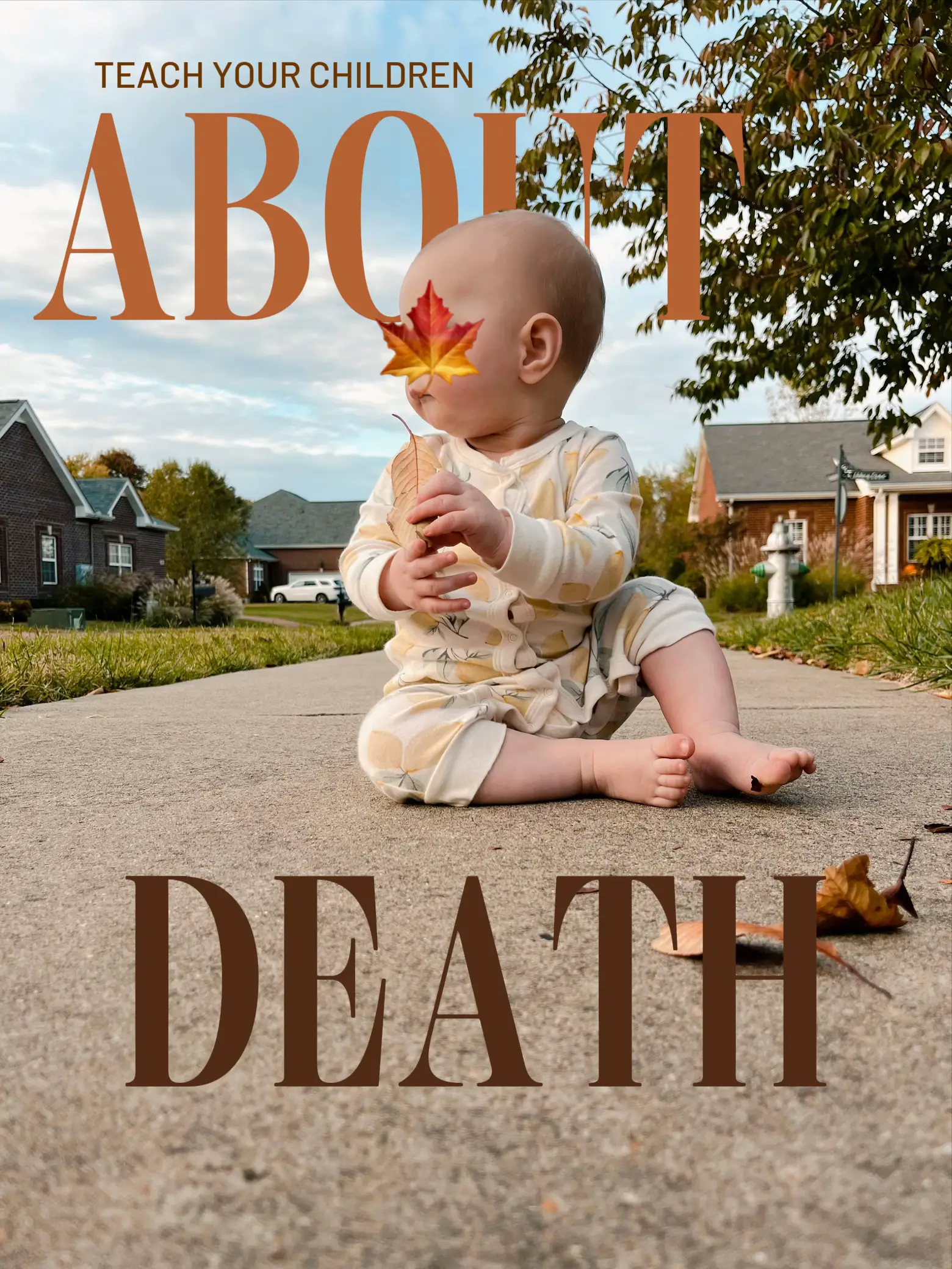  A baby is laying on the ground holding a leaf.