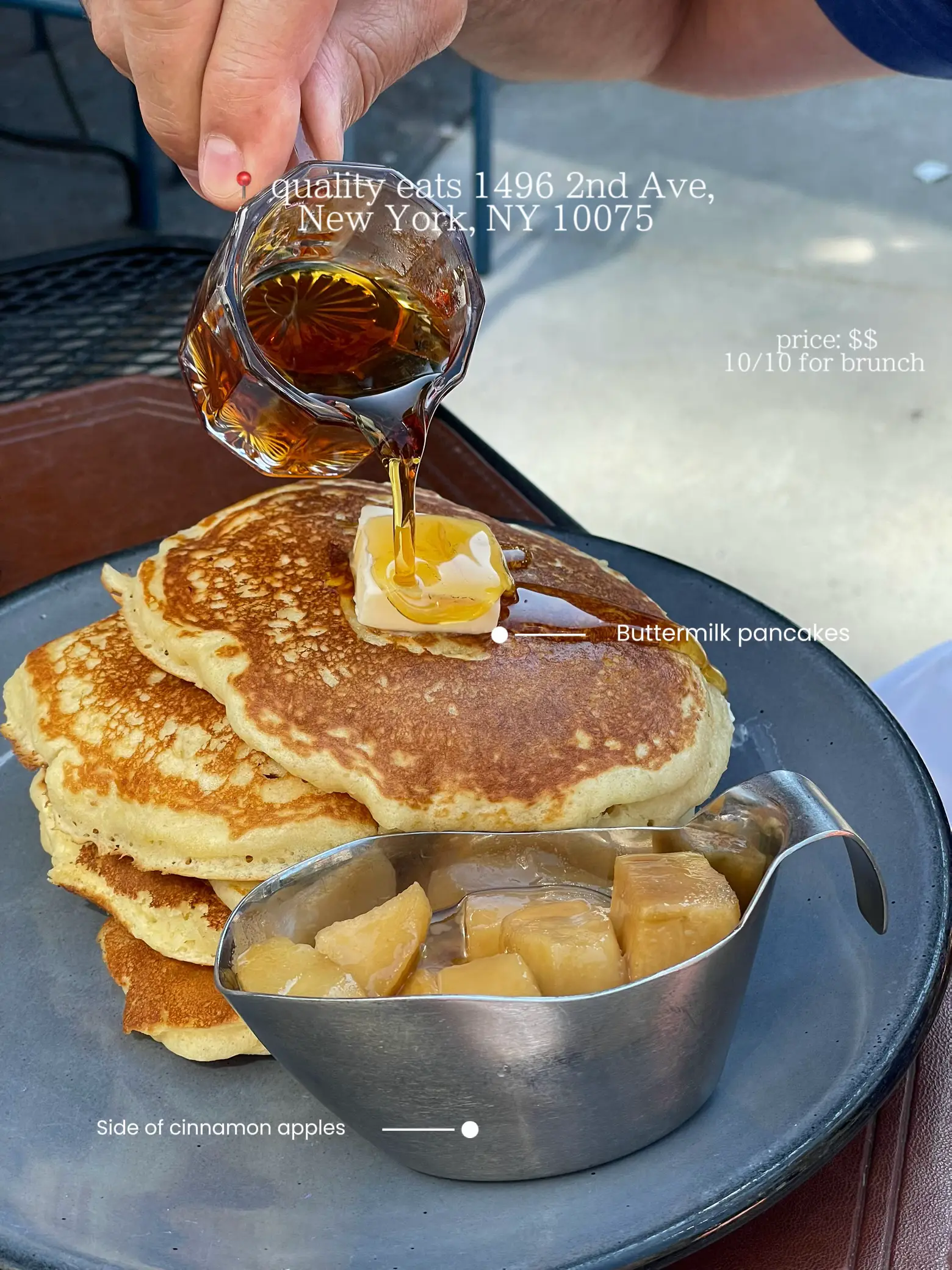  A plate of pancakes with syrup and a side of cinnamon apples.