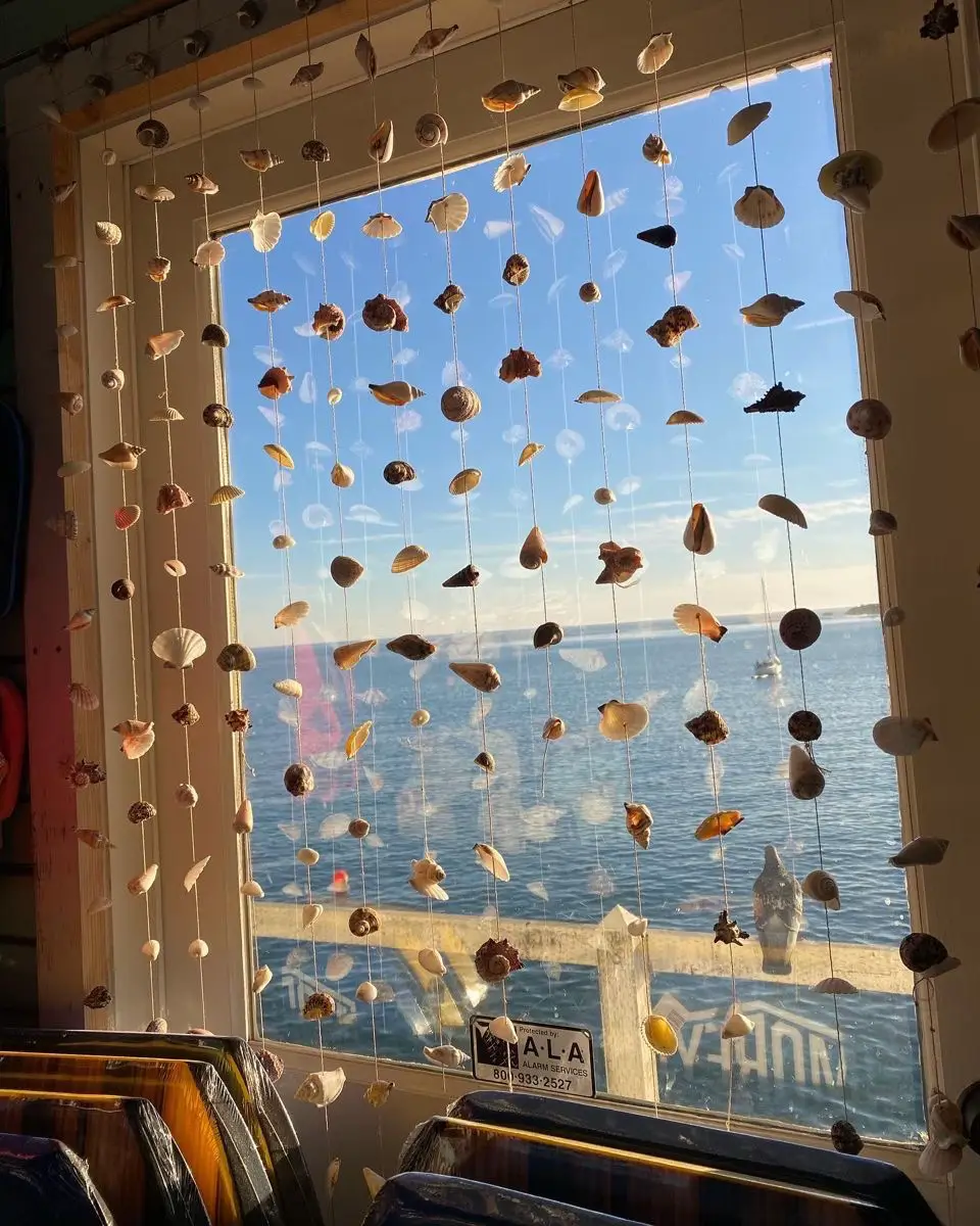  A window with a picture of the ocean on it.