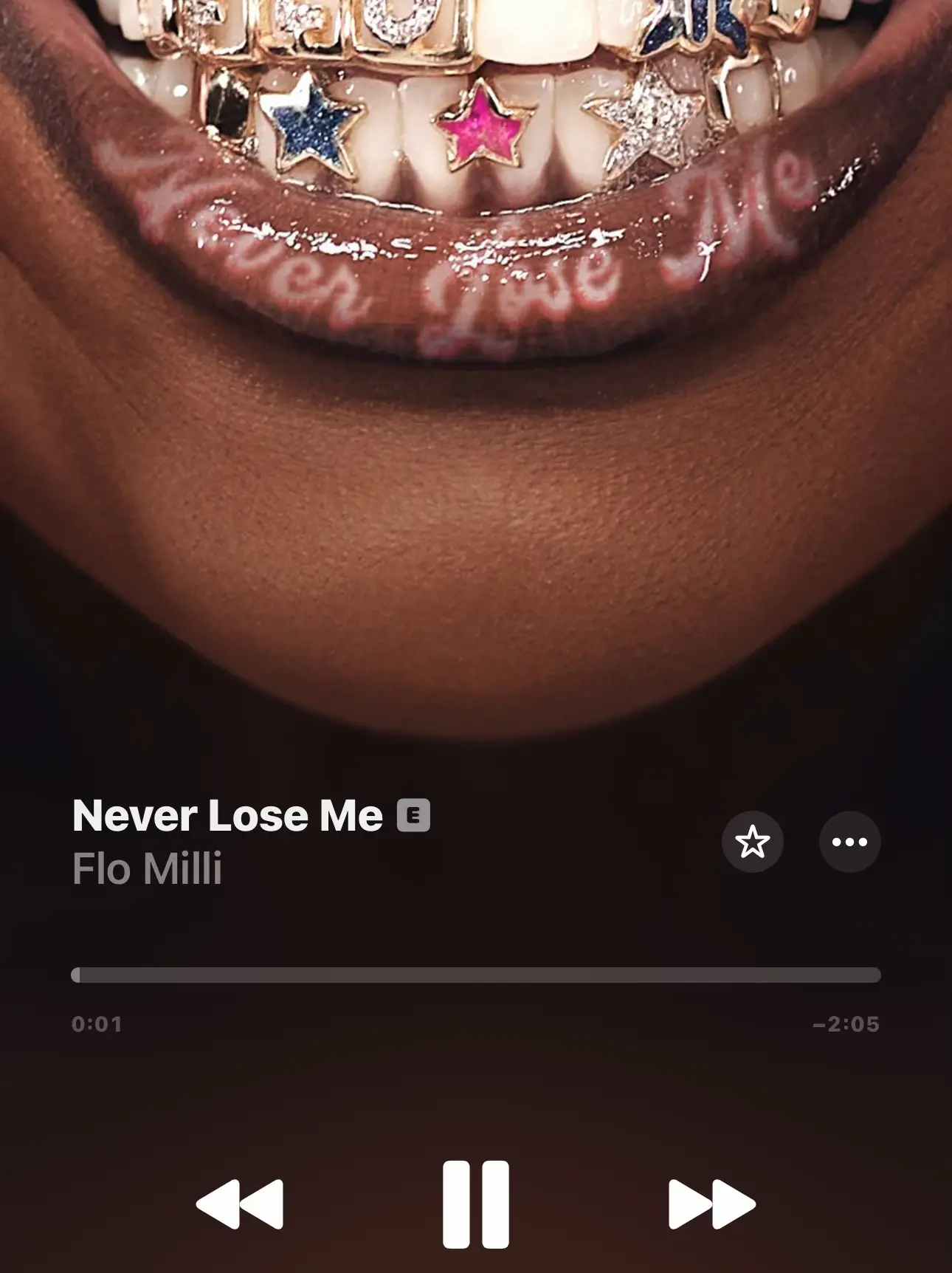  A picture of a person's mouth with the words "never lose me" and "flo milli" written above it.