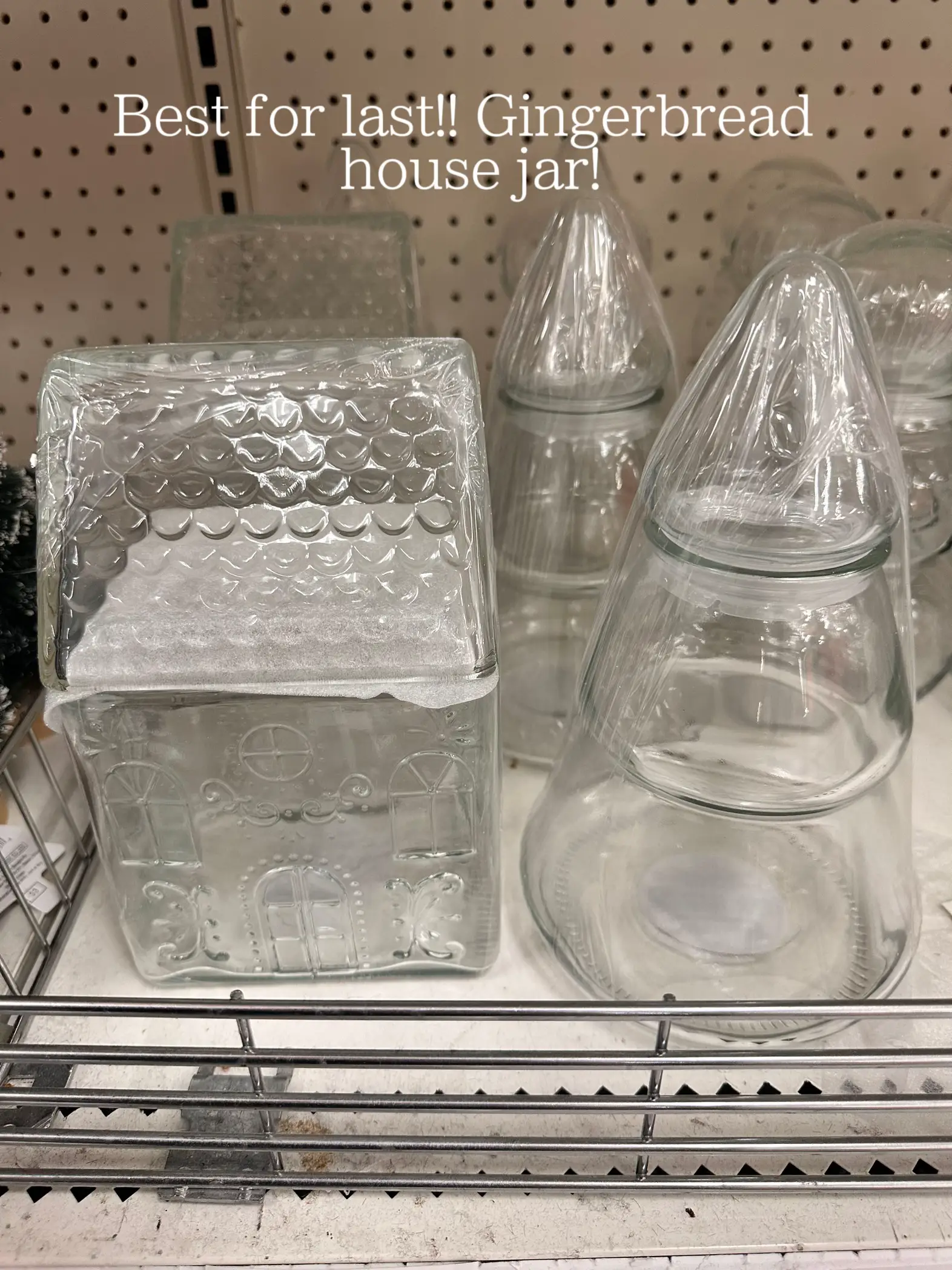  A shelf with several glass jars on it.