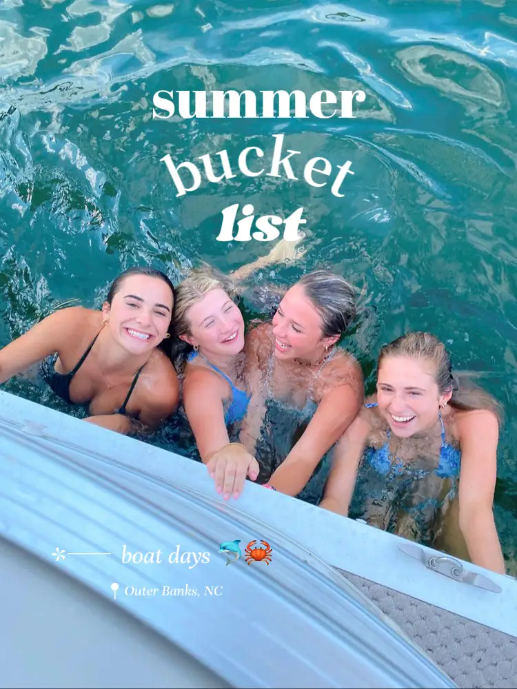  A group of four women are sitting in a body of water, enjoying their time together. They are wearing bathing suits and are smiling. The image is captioned with a boat day in Outer Banks, NC