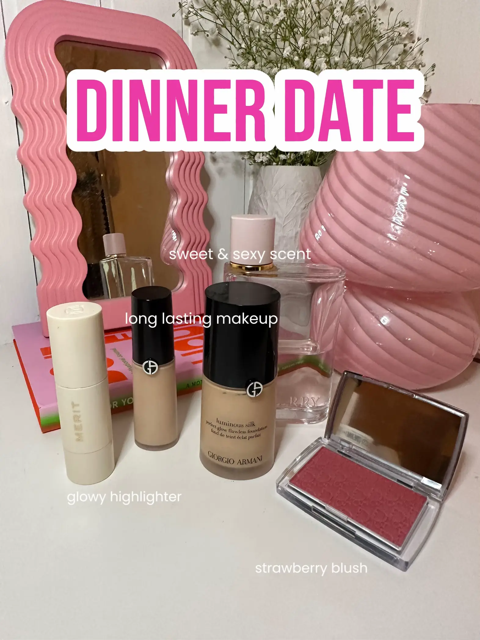  A pink table with a vase and a box of makeup on it.