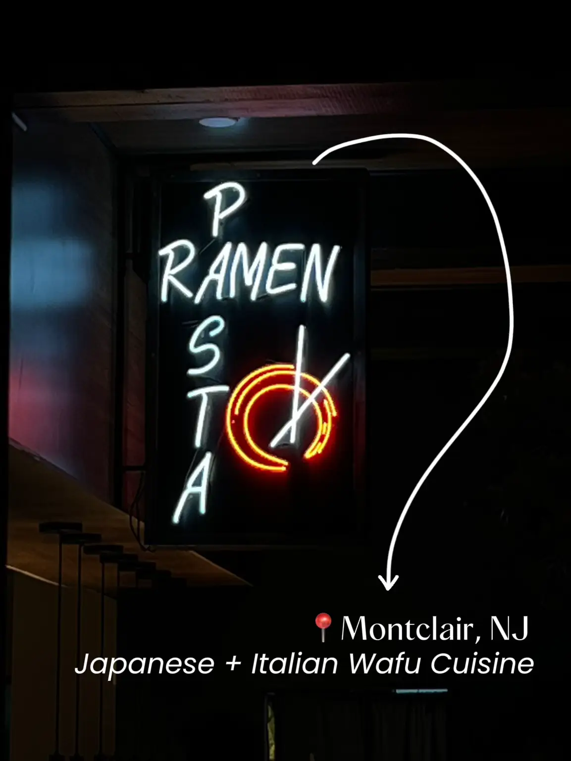  A neon sign that says ramen and sushi.